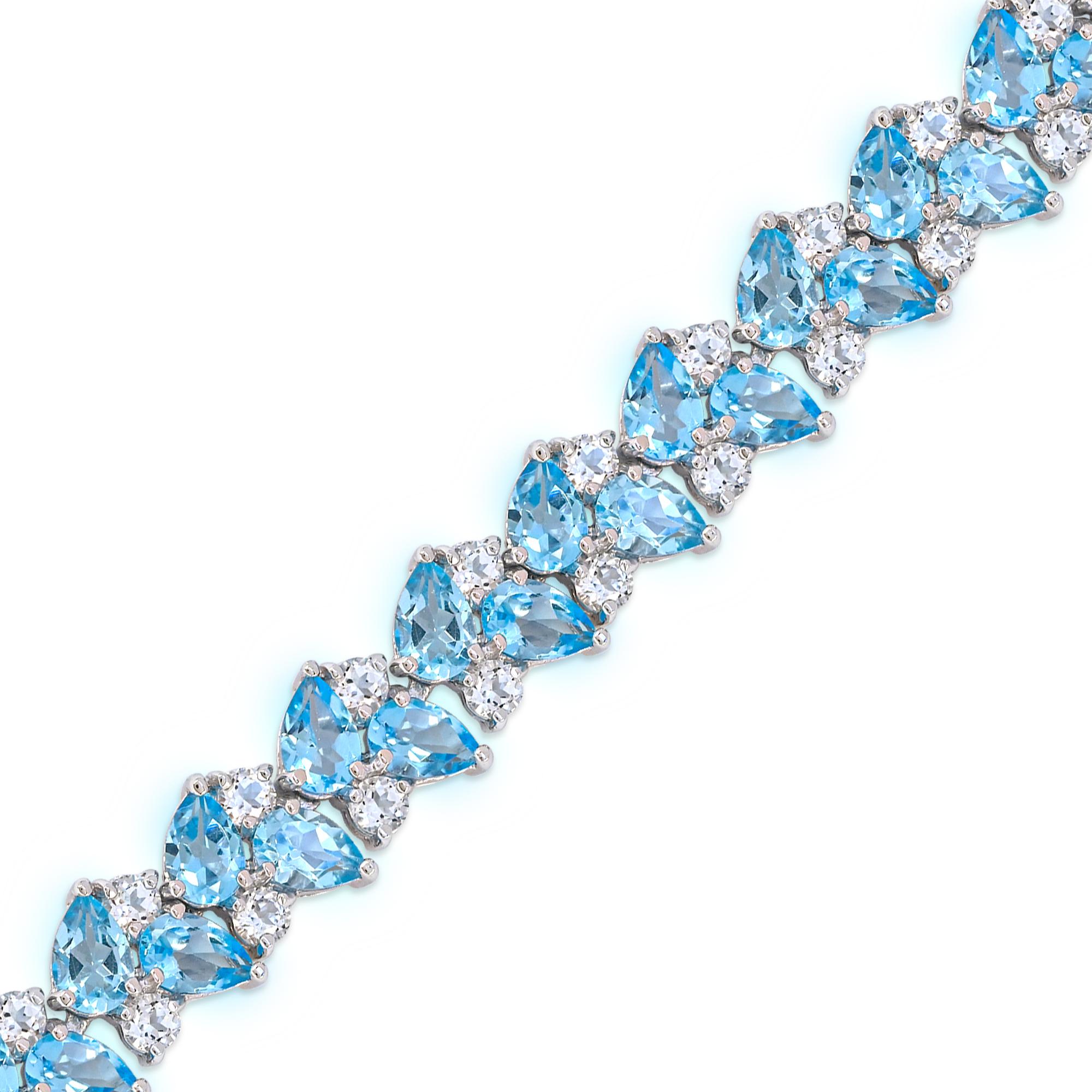 Indulge in the elegance of our Swiss Blue and White Topaz in Sterling Silver. Crafted with meticulous attention to detail, this bracelet boasts a stunning combination of 46 pieces of pear-cut Swiss blue topaz accented by 46 pieces of shinning round