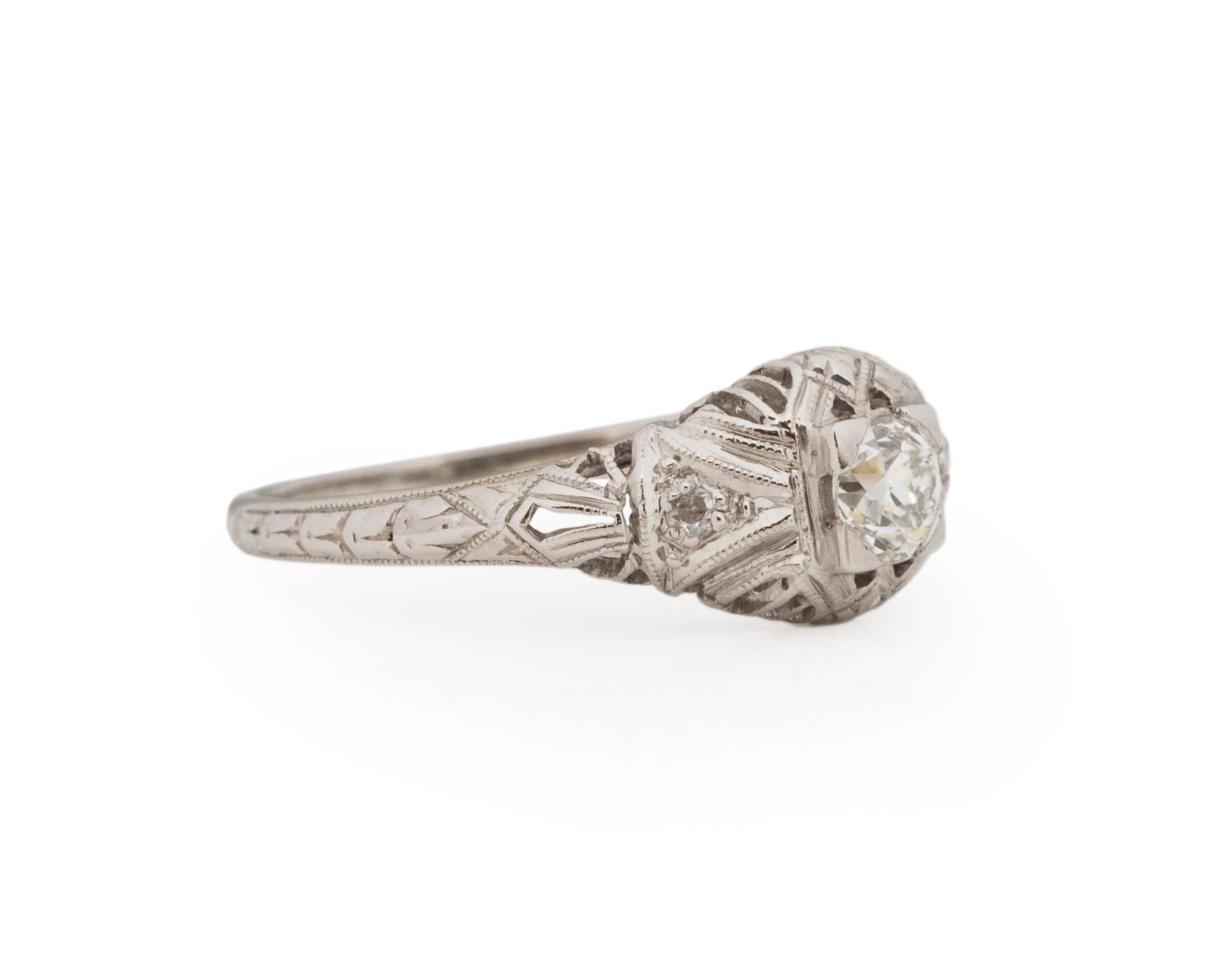 Ring Size: 6.5
Metal Type: Platinum [Hallmarked, and Tested]
Weight: 2.0 grams

Center Diamond Details:
Weight: .31ct
Cut: Old European brilliant
Color: F
Clarity: VS

Side Stone Details:
Weight: .08ct, total
Cut: Antique European Cut
Color: