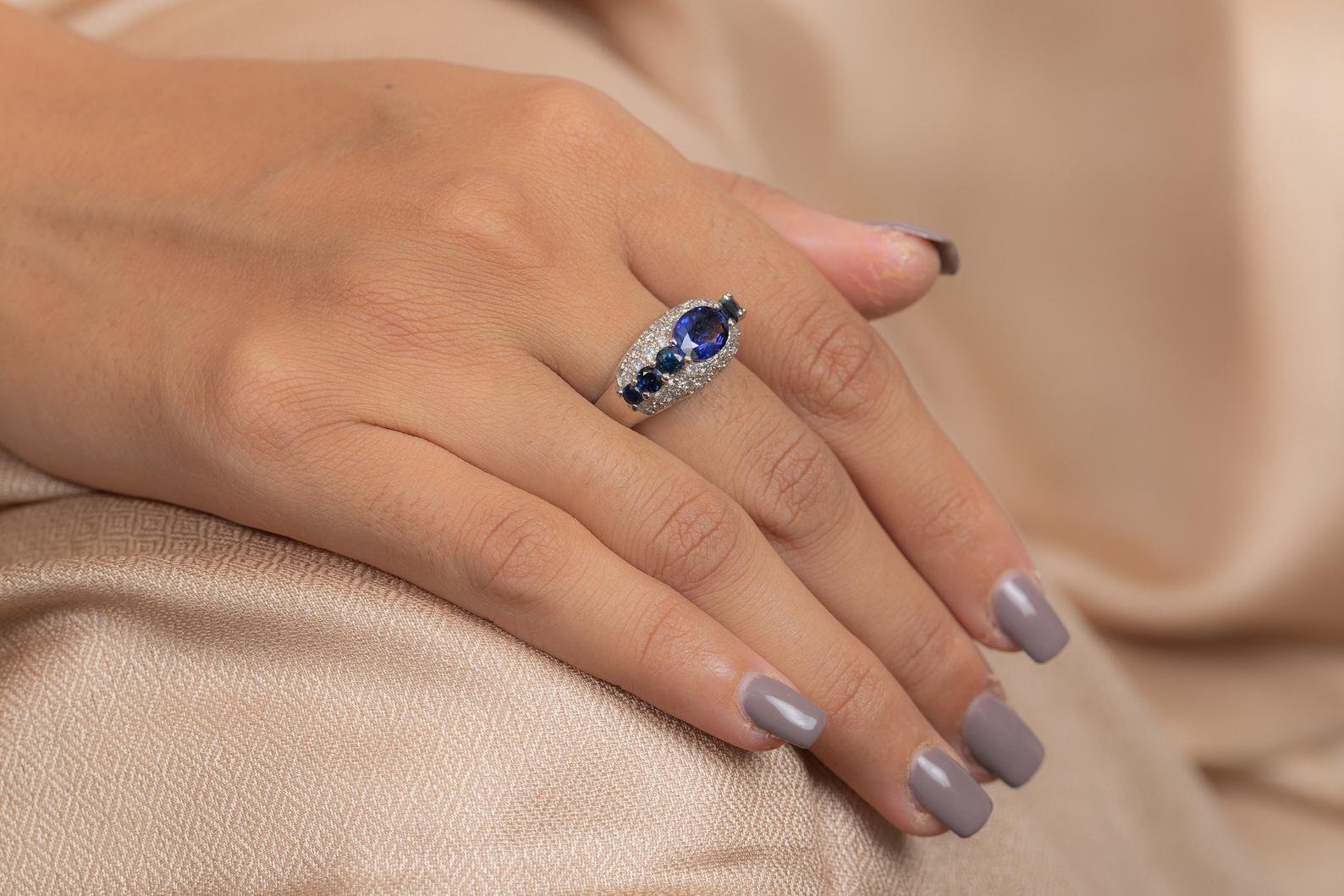 This ring has been meticulously crafted from 14-karat gold.  It is hand set with 3.1 carat blue sapphire & .95 carats of sparkling diamonds. 

The ring is a size 8 and may be resized to larger or smaller upon request. 
FOLLOW  MEGHNA JEWELS
