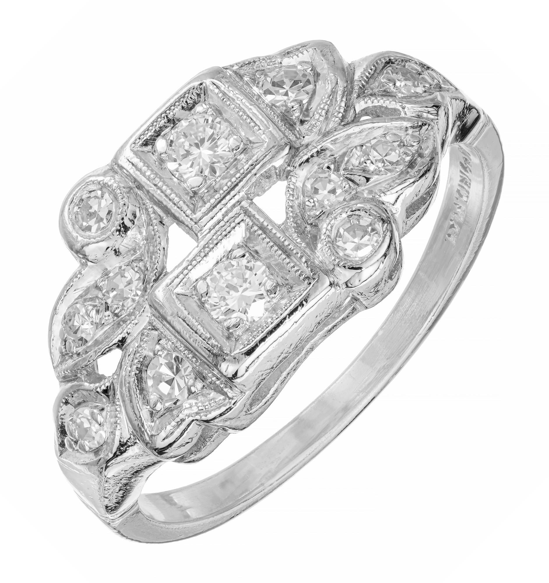 Simple yet stylish 1940's  swirl platinum diamond ring. 2 full cut diamonds set in platinum with 10 round single cut accent diamonds.

2 full cut diamonds, G-H vS approx. .14cts
10 single cut diamonds, G-H VS approx..17cts
Size 7.75 and