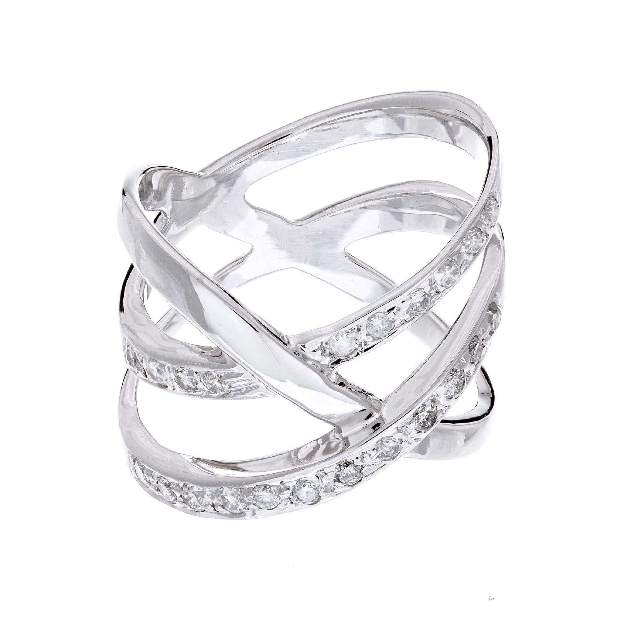 Three row criss cross diamond band ring, in 18k white gold with 21 round brilliant cut diamonds. 

21 round brilliant cut diamonds, H-I I approx. .31cts
Size 7.75 and not sizable
14k white gold
Stamped: 14k
7.6 grams
Width at top: 1.9mm
Height at