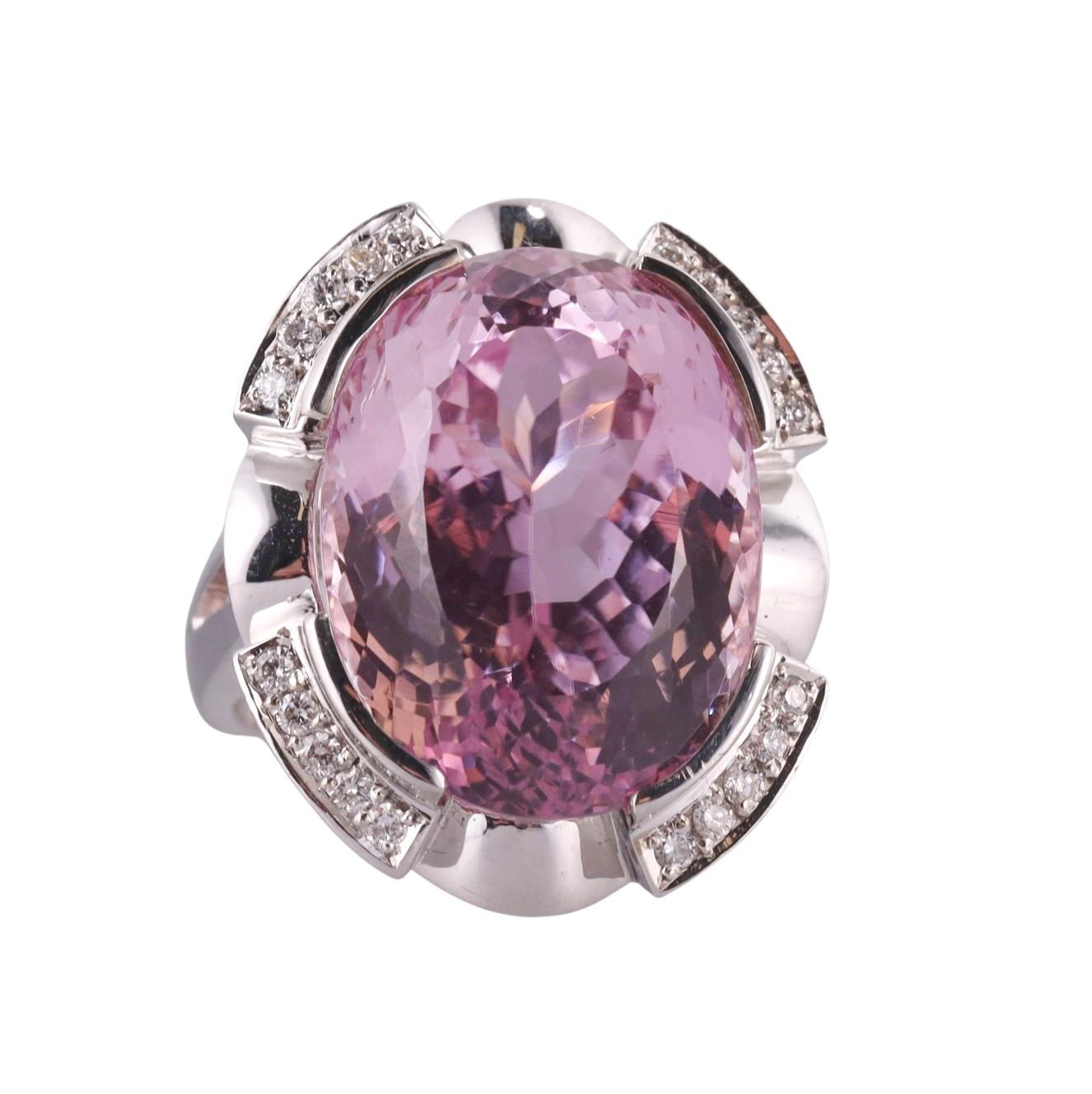 Large 14k gold cocktail ring, featuring approx. 31ct kunzite (stone measures 21.5 x 16.3 x 12.8mm), surrounded with 0.20ctw H/Si1 diamonds.  Ring size 7.5, top is 26mm x 23mm. Marked 14k. Weight of the piece - 21 grams. 