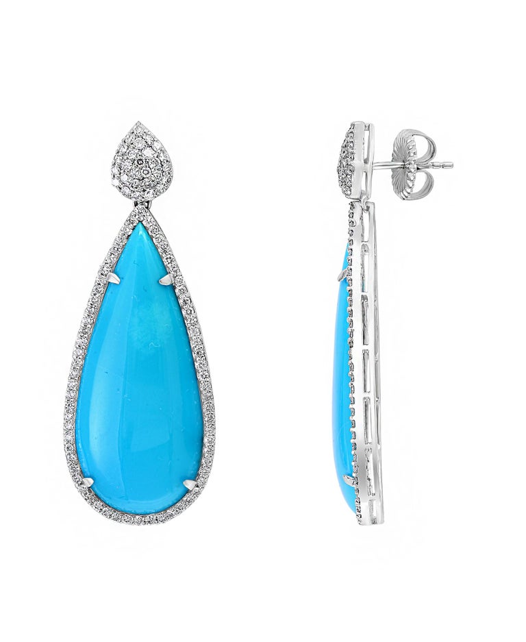 31 Carat  Natural Sleeping Beauty Turquoise & Diamond Cocktail Hanging Earring  18 K White Gold , 
natural sleeping beauty which is hard to find .
Very desirable color and quality.
perfect pair made in 18 Karat White gold
Gold 18 Grams
 Diamonds: