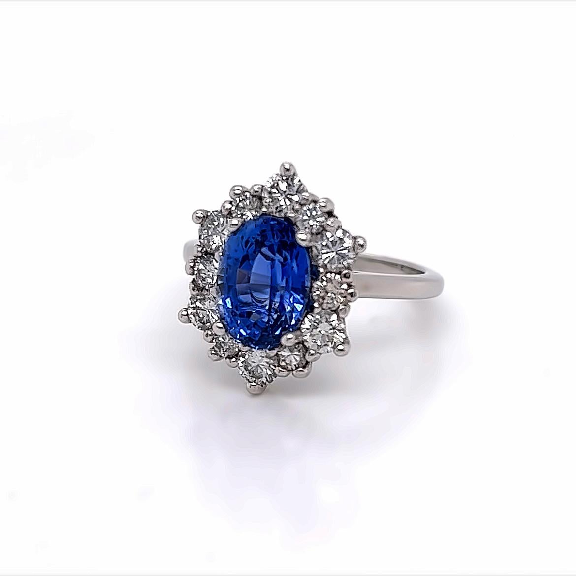 Oval Cut 3.1 Carat Oval Blue Sapphire and Diamond Ring in Platinum For Sale