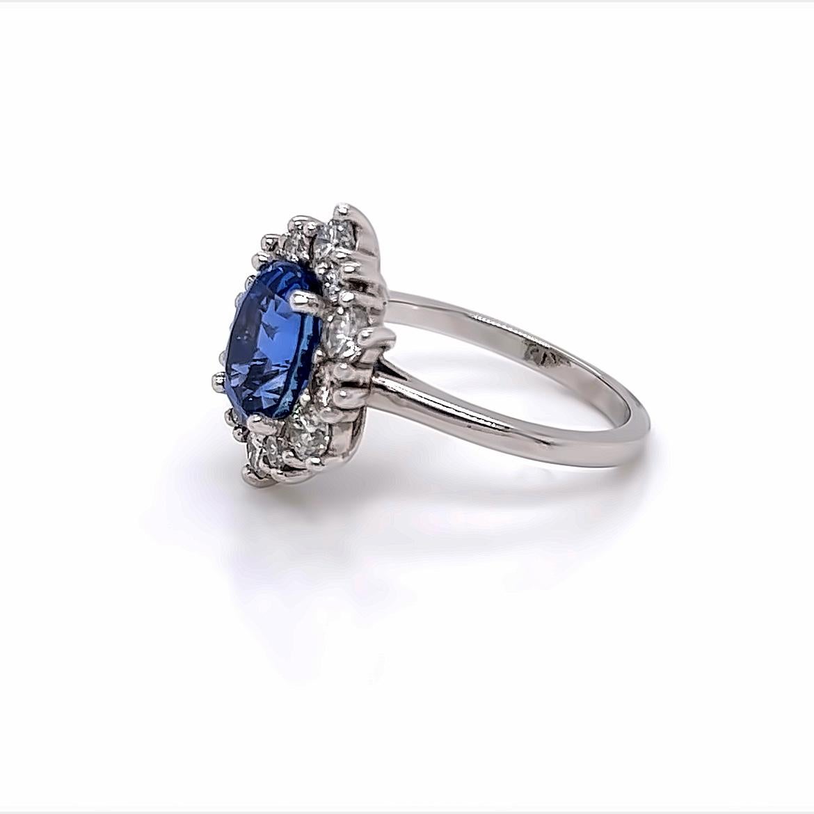 Women's 3.1 Carat Oval Blue Sapphire and Diamond Ring in Platinum For Sale