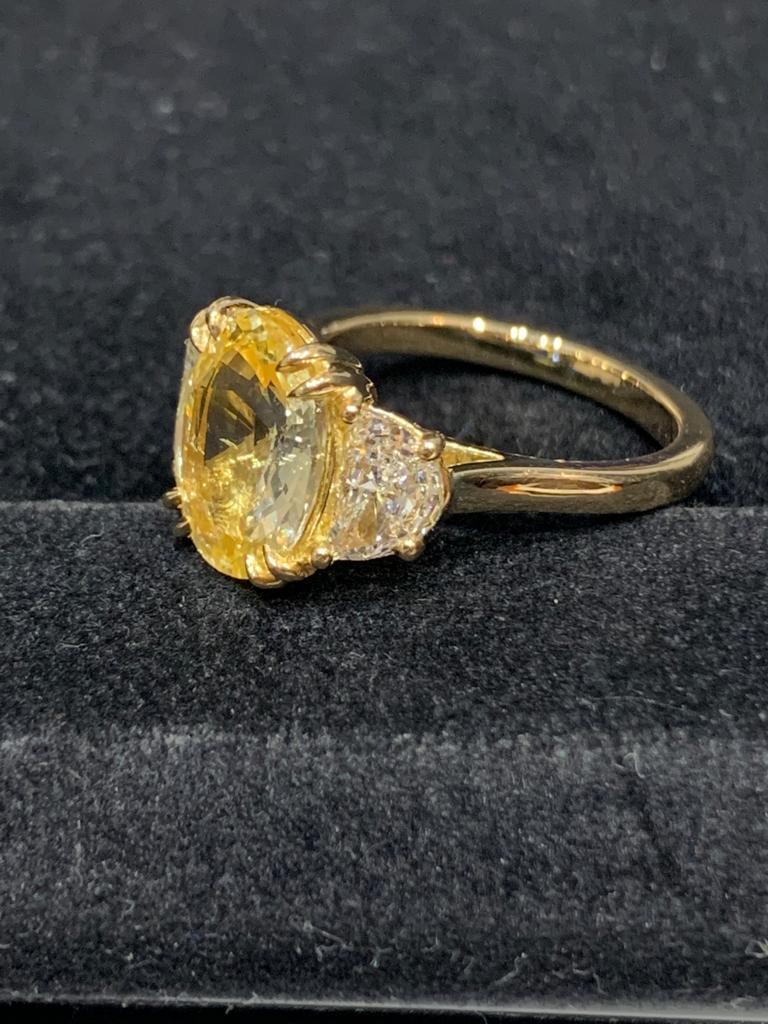 3.1 Carat Oval Cut Unheated Yellow Sapphire and Diamond Ring in 18K Yellow Gold For Sale 2