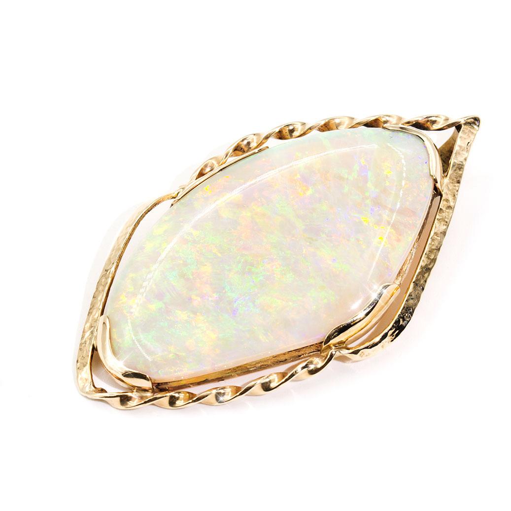 Lovingly crafted in 9 carat yellow gold is this enchanting vintage pendant with an alluring 31 carat solid Australian Crystal Opal taking centre stage, and carefully set in a solid four flat clawed decorative free form setting. This striking piece