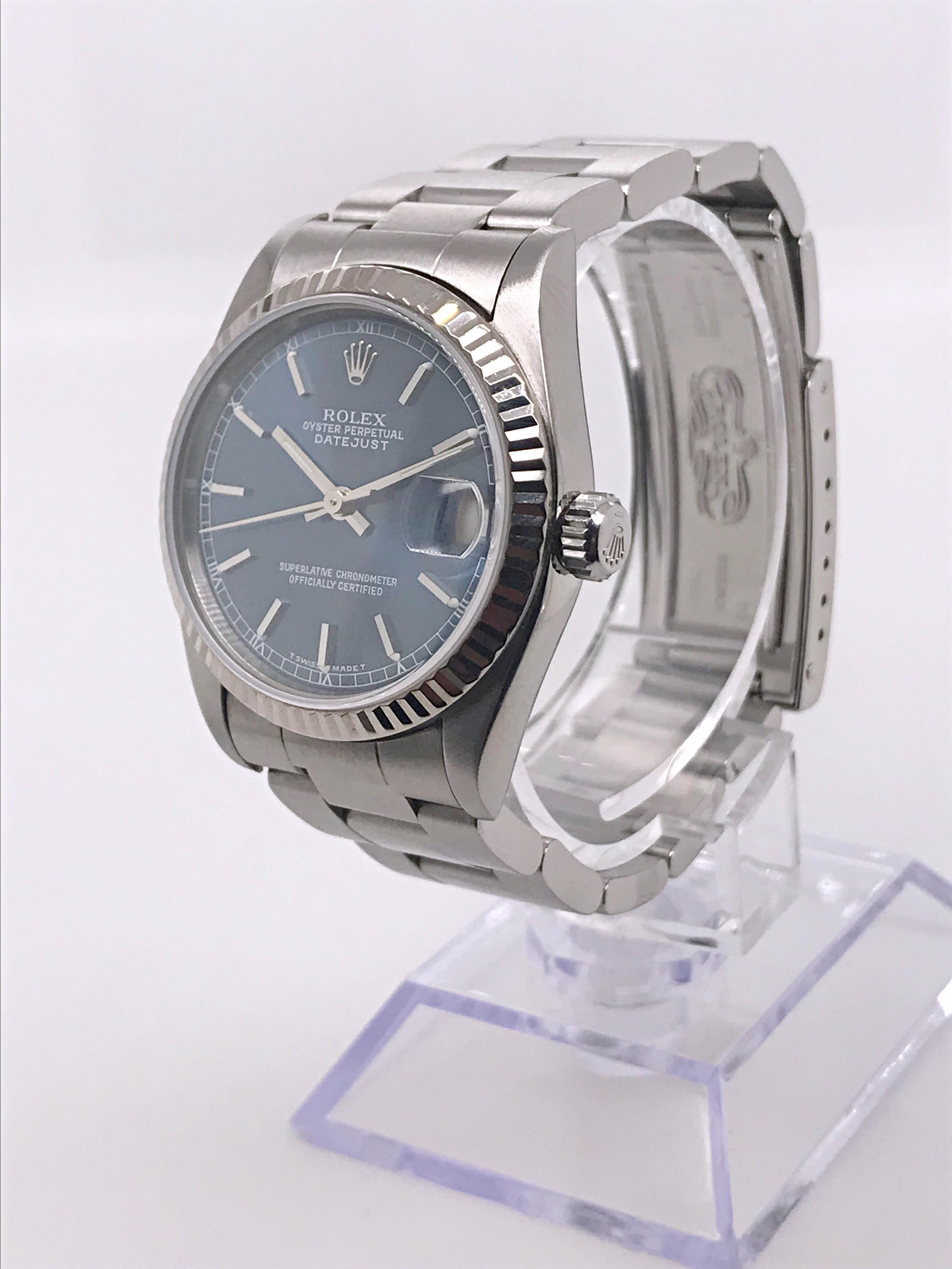 This Midsize Rolex is 31 mm and features an elegant blue dial along with a date function. This watch also has a quick set date function and is on an oyster bracelet made from stainless steel. The bezel is 18kt white gold, fluted style. Circa 1998