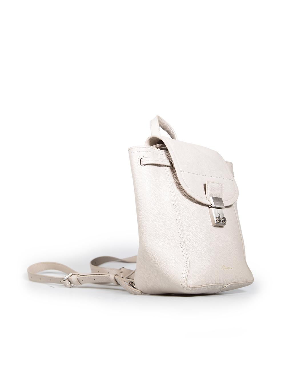 CONDITION is Good. General wear to backpack is evident. There are abrasions across the hardware. There is some discolouration on the leather surrounding the strap bases. The metal strap loops are tarnished. There is some general abrasions along the