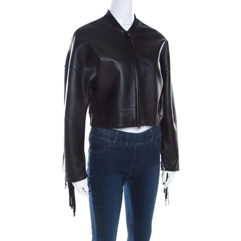 This trendy lam leather jacket from 3.1 Phillip Lim would make you the centre of attention of any event in no time. Be a trendsetter by simply flaunting this delightful jacket in black adorned with heavy fringe details to the rear. It is styled with