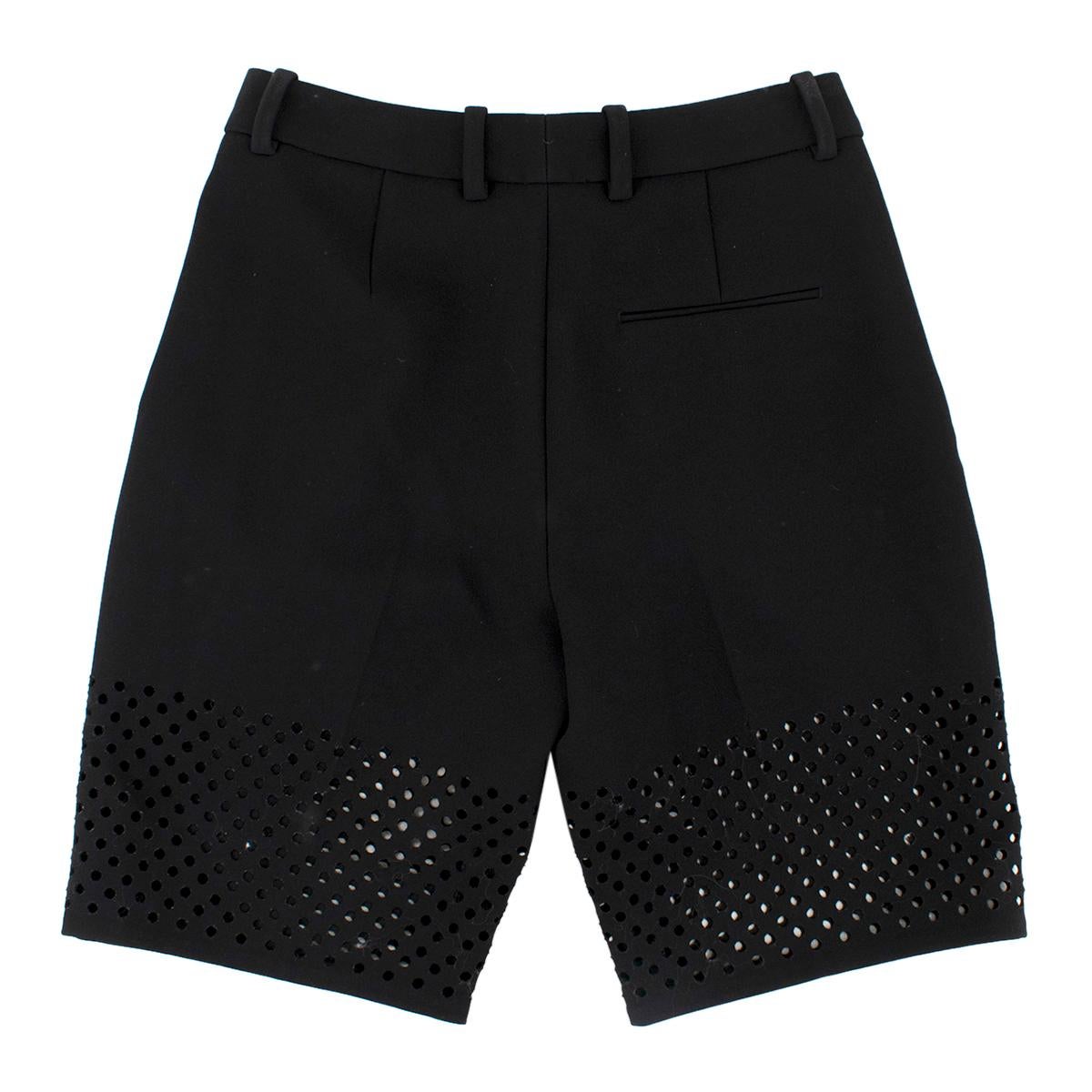 Phillip Lim Black Lasercut Bermuda Shorts

- Black bermuda shorts 
- Laser cut outs to the bottom 
- Zip, button and hooks fastening to the middle front
- Lined
- Belt hoops

Please note, these items are pre-owned and may show some signs of storage,
