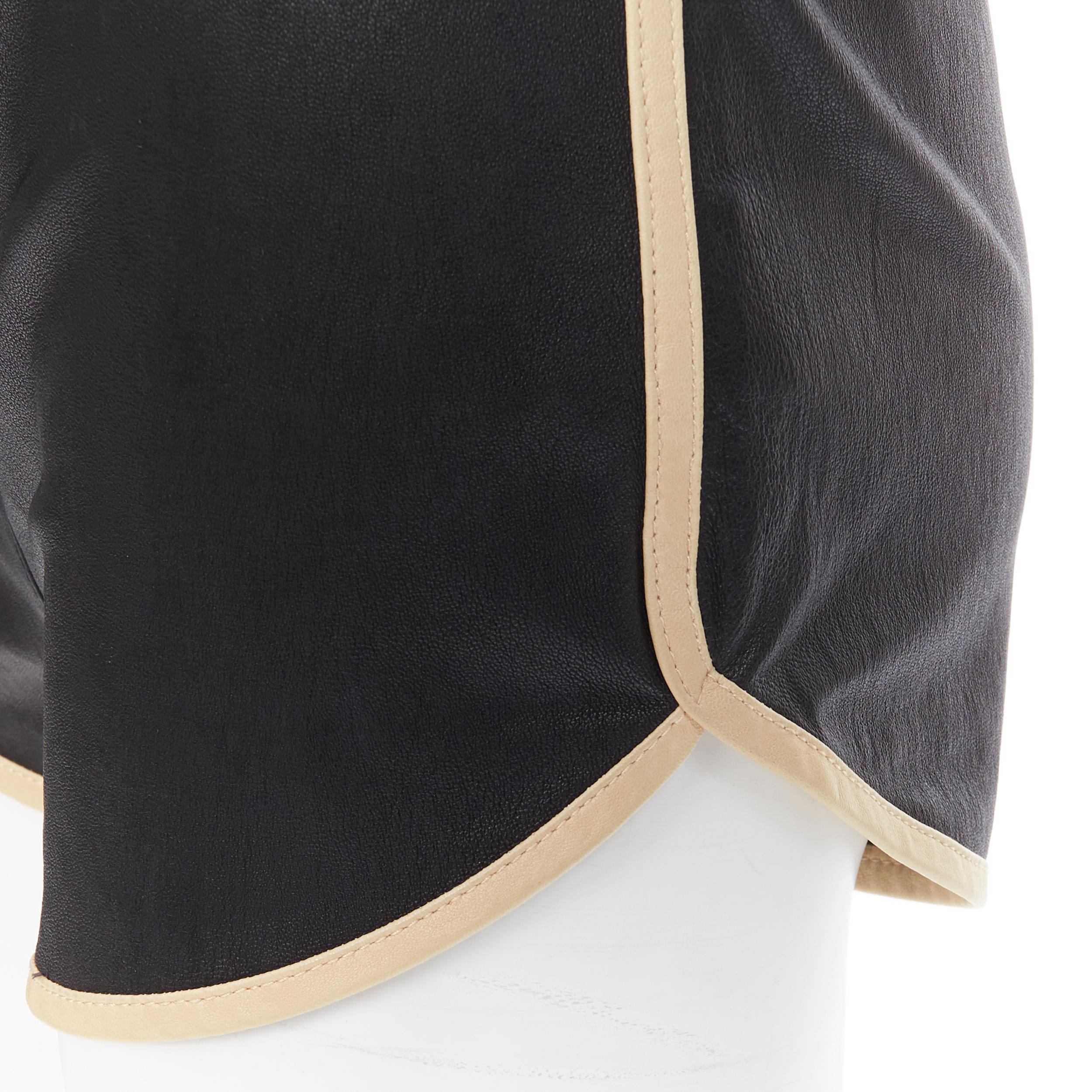 3.1 PHILLIP LIM  black leather beige trimmed curved hem drawstring shorts US0
Reference: LNKO/A01332
Brand: 3.1 Phillip Lim
Designer: Phillip Lim
Material: Leather
Color: Black
Pattern: Solid
Closure: Drawstring
Made in: China

CONDITION:
Condition: