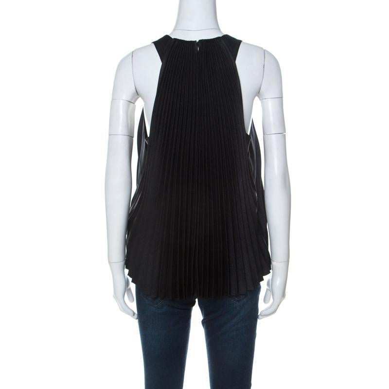 Phillip Lim elevates a basic with this black pleated top. Made from blended fabric, the top is feminine and a go to for impromptu plans. It is lined with silk to give a luxurious feel. The pleats and color are flattering on all.

