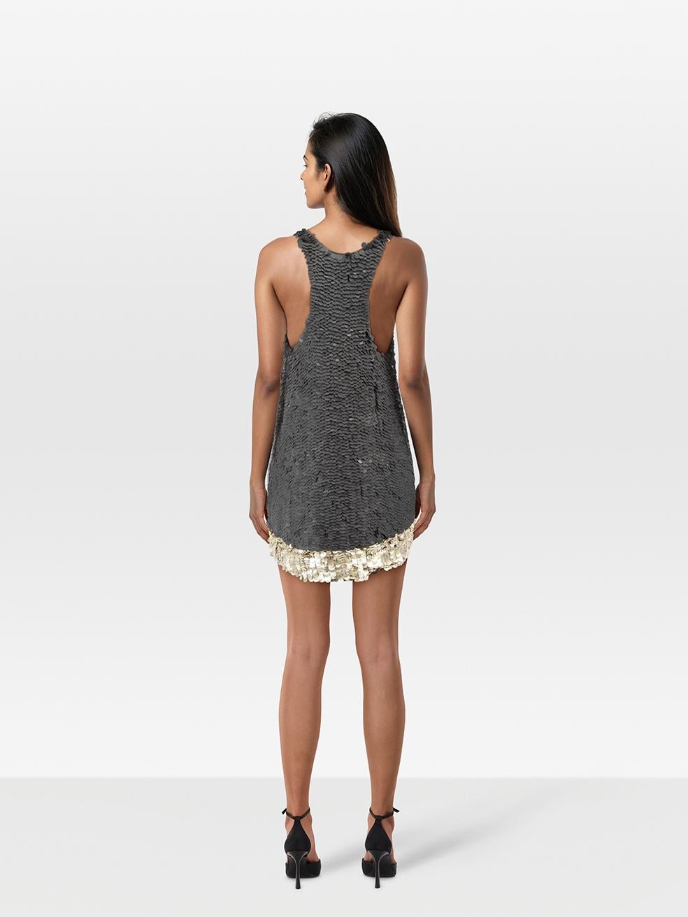 CONDITION is Very good. Minimal wear to the dress is evident. Marks across the sequins on the front and back. Discolouration under the armpits and the back neck designer label. Plucks to the stitching holding the sequins on the lower front and left