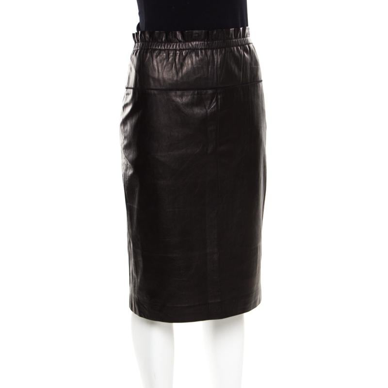 Creations from 3.1 Phillip Lim are always worth buying since they are effortlessly stylish! This brown pencil skirt is made of 100% lamb leather and features a flattering silhouette. It flaunts a ruffle detailed waist and will look best with a