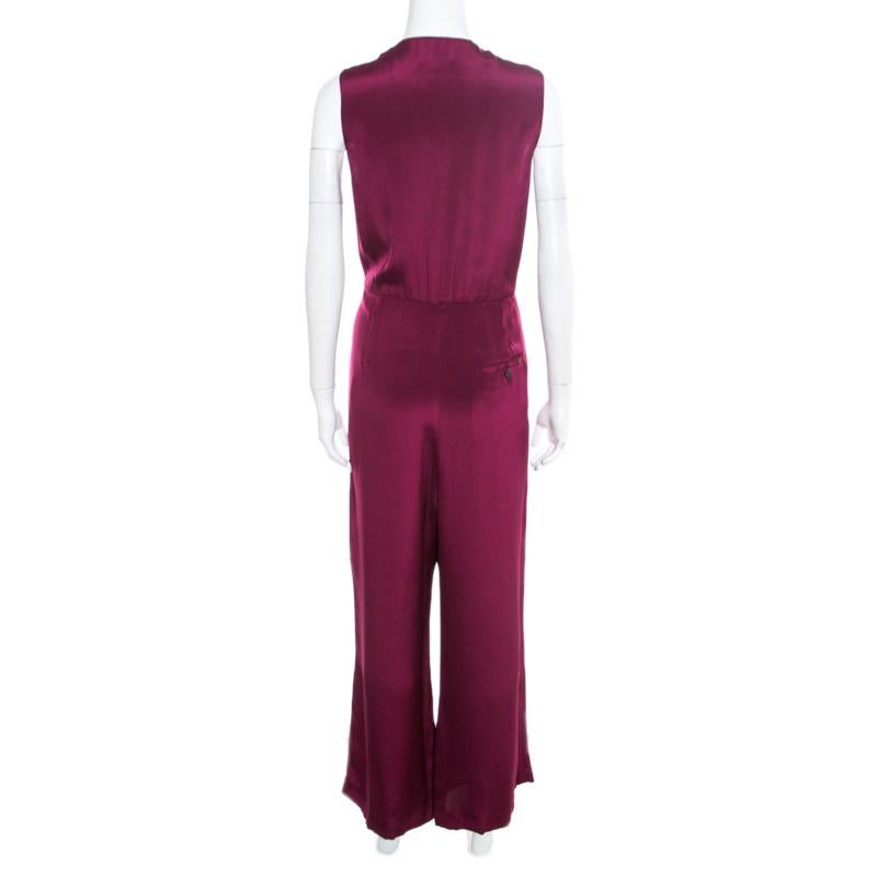 Fabulously designed to make you look nothing less than a diva, this 3.1 Phillip Lim jumpsuit deserves a special place in your wardrobe! The burgundy creation is made of 100% silk and features a wide leg silhouette. It flaunts rhinestones embellished