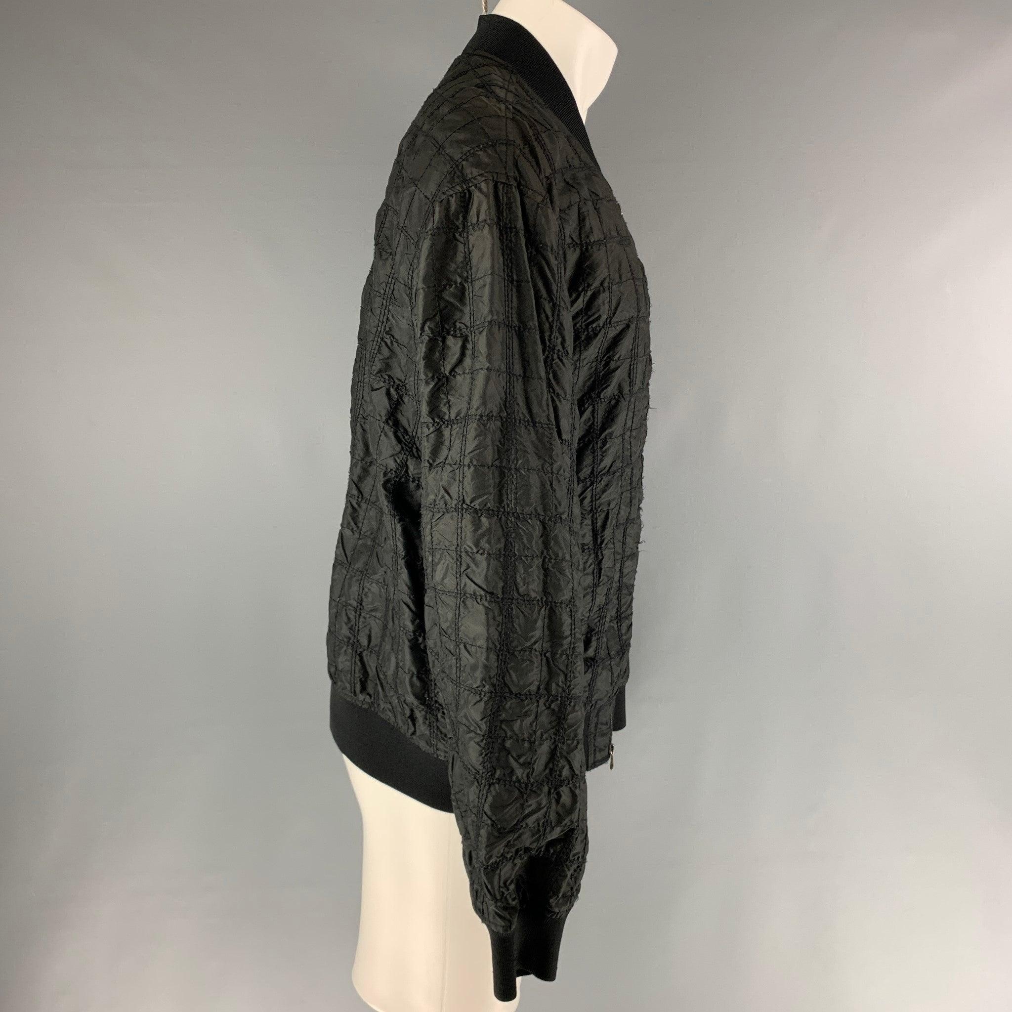 3.1 PHILIP LIM black bomber jacket comes in black silk and viscose blend, and features a quilted effect.Very Good Pre-Owned Condition. 

Marked:   M 

Measurements: 
 
Shoulder: 22 inches Chest: 46 inches Sleeve: 25 inches Length: 27 inches  
  
  
