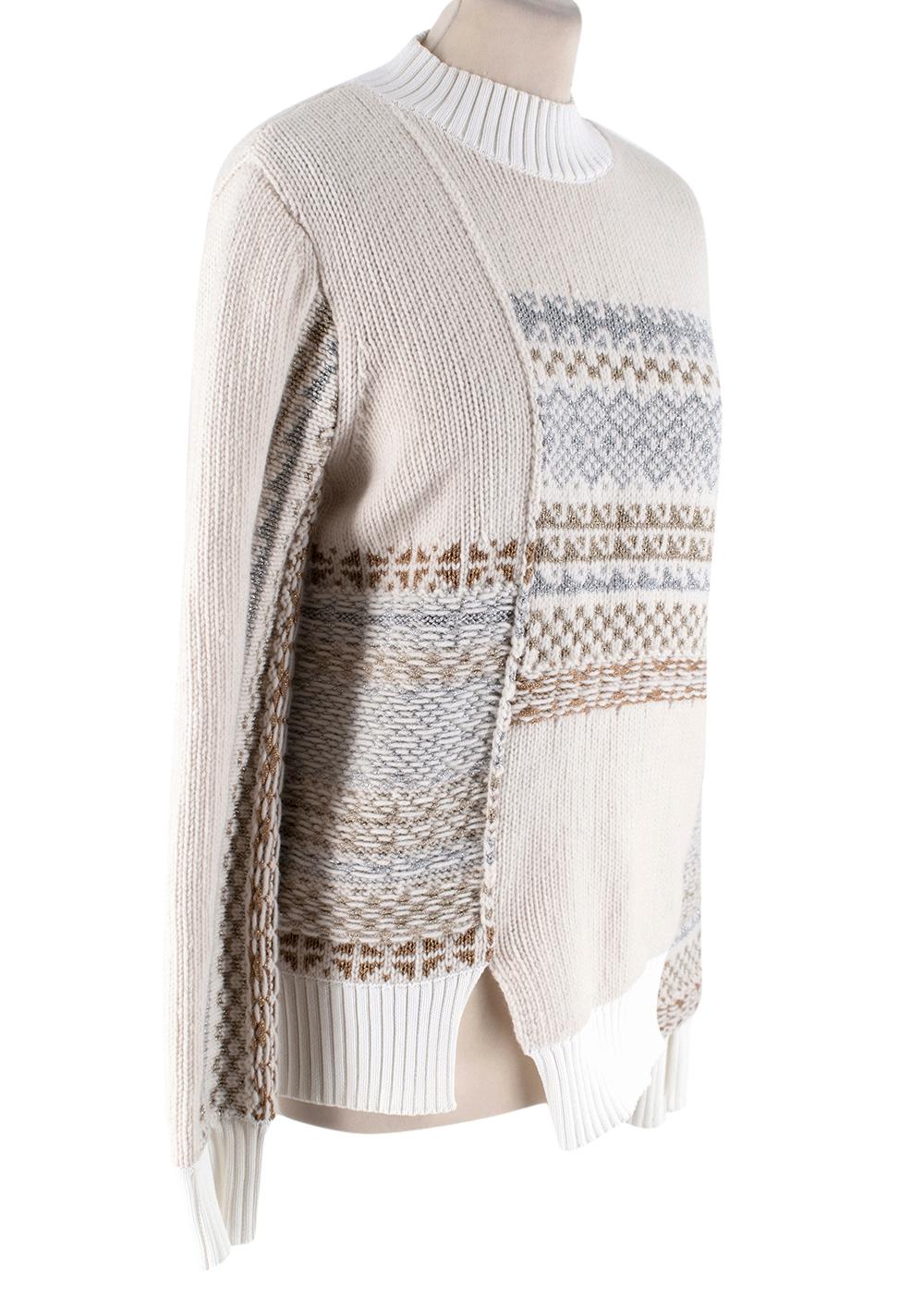 3.1 Phillip Lim Wool Embroidered Sweater

- Hight neckline 
- Ribbed knit to neckline, hemline and cuffs 
- Embroidered knit 
- Small slit at front 
- press piece 

Materials 
100% Wool 

Dry clean only 

shoulders: 11cm
sleeves: 67cm
Length: 60cm