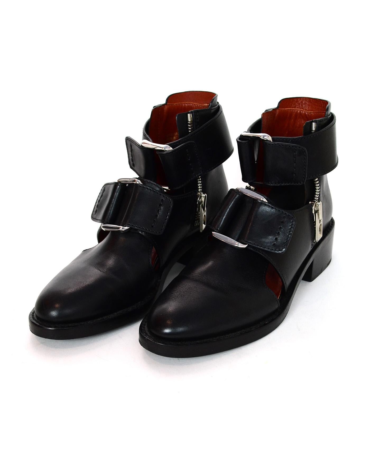 3.1 Phillip Lim Leather Addis Cutout Booties W/ Strap Sz 36

Made In: China
Color: Black and silver
Hardware: Silvertone
Materials: Leather 
Closure/Opening: Slide on with small side zips
Overall Condition: Excellent pre-owned condition with