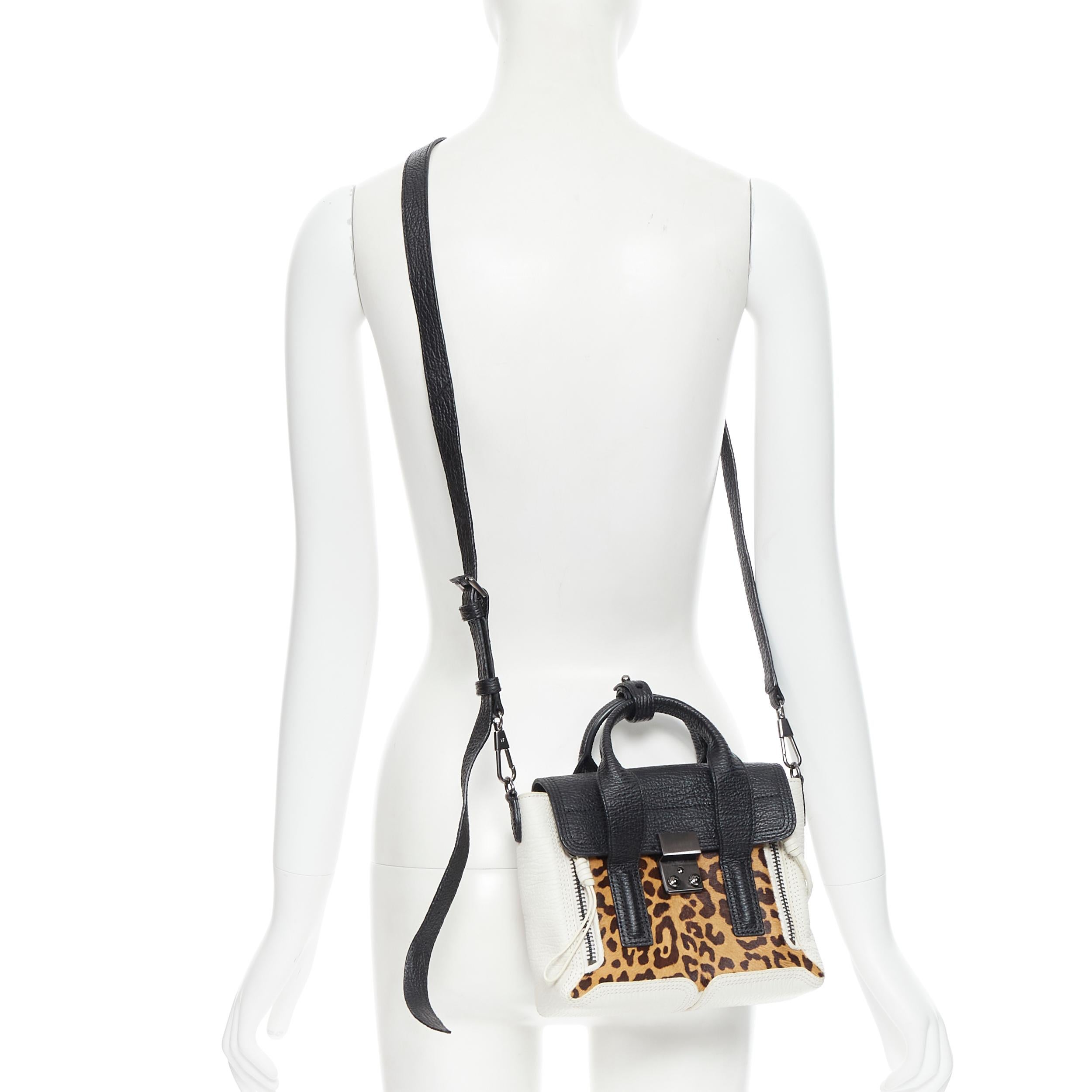 3.1 PHILLIP LIM Mini Pashli black white leopard leather crossbody satchel bag Reference: CAWG/A00164 
Brand: 3.1 Phillip Lim 
Designer: Phillip Lim 
Model: Mini Pashli 
Material: Leather 
Color: Brown 
Pattern: Leopard 
Closure: Clasp 
Extra Detail: