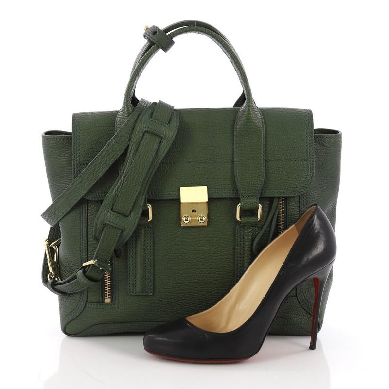 This 3.1 Phillip Lim Pashli Satchel Leather Medium, crafted from green leather, features dual top handles, expandable zip sides, and gold-tone hardware. Its top flap push-lock closure opens to a black satin interior with leather side zip pocket.