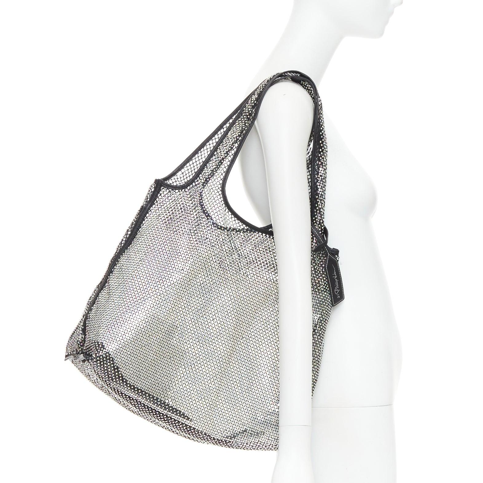 3.1 PHILLIP LIM psychedelic fine crystal mesh PVC lined market tote bag
Reference: LAYU/A00074
Brand: 3.1 Phillip Lim
Designer: Phillip Lim
Model: Market
Material: Mesh, Leather
Color: Multicolour, Black
Pattern: Crystals
Lining: Clear PVC
Extra