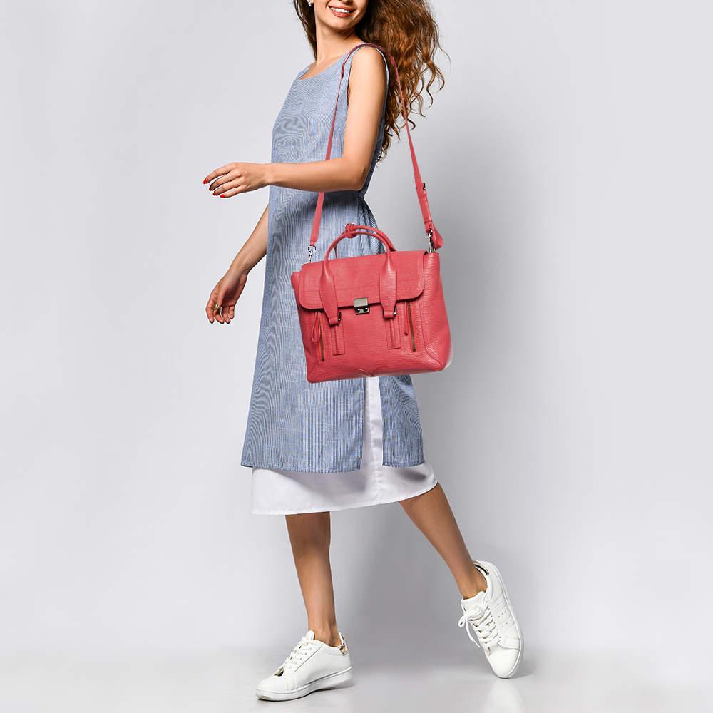 This authentic designer satchel is rendered in the finest quality materials into an elegant design. Versatile and functional  this carryall is well sized for your daily use.