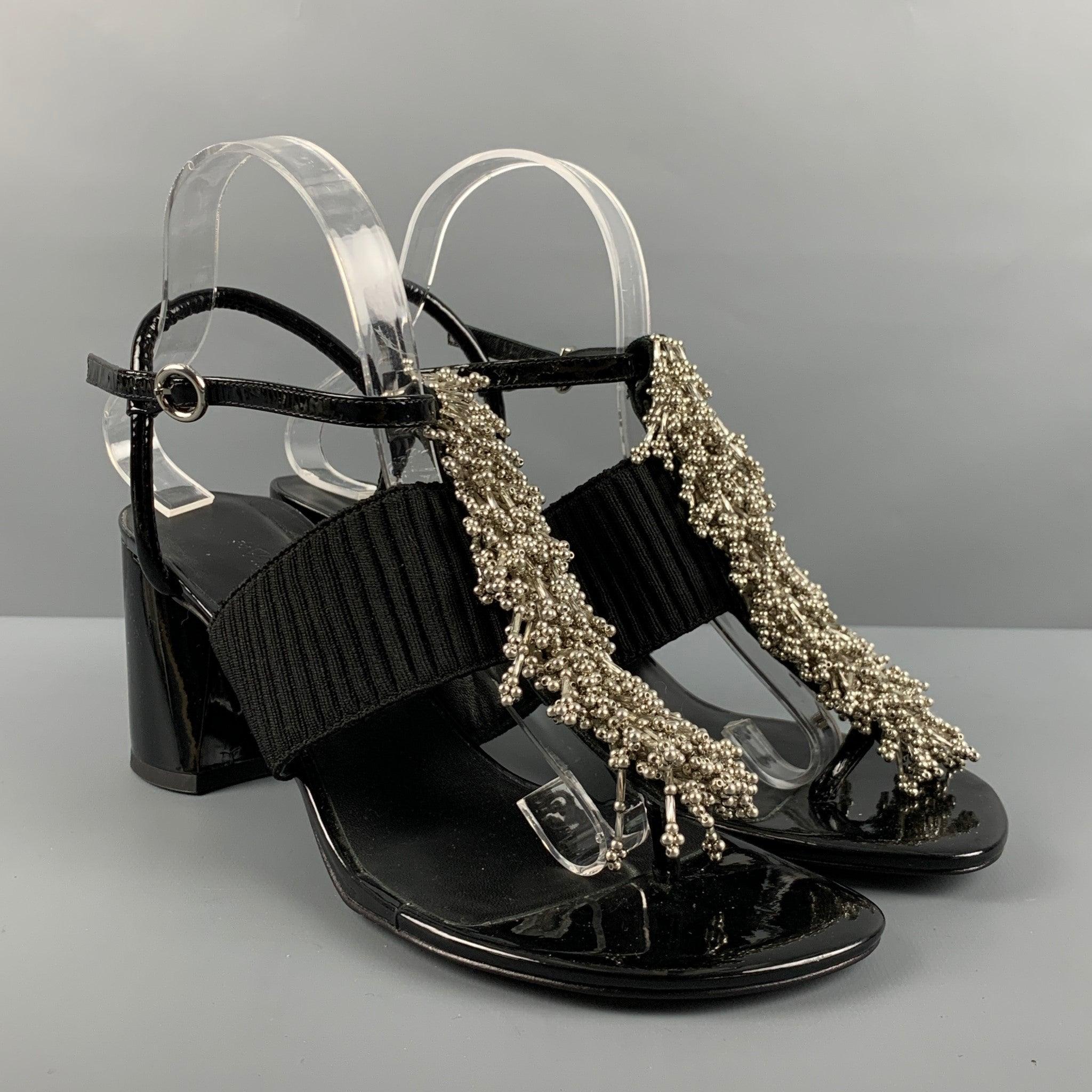 3.1 PHILLIP LIM sandals comes in a black patent leather featuring silver tone beaded details at center front, round chunky heel, elastic support, and an ankle strap closure. Comes with dust bag.
VERY Good Pre-Owned Condition. Minor signs of wear.