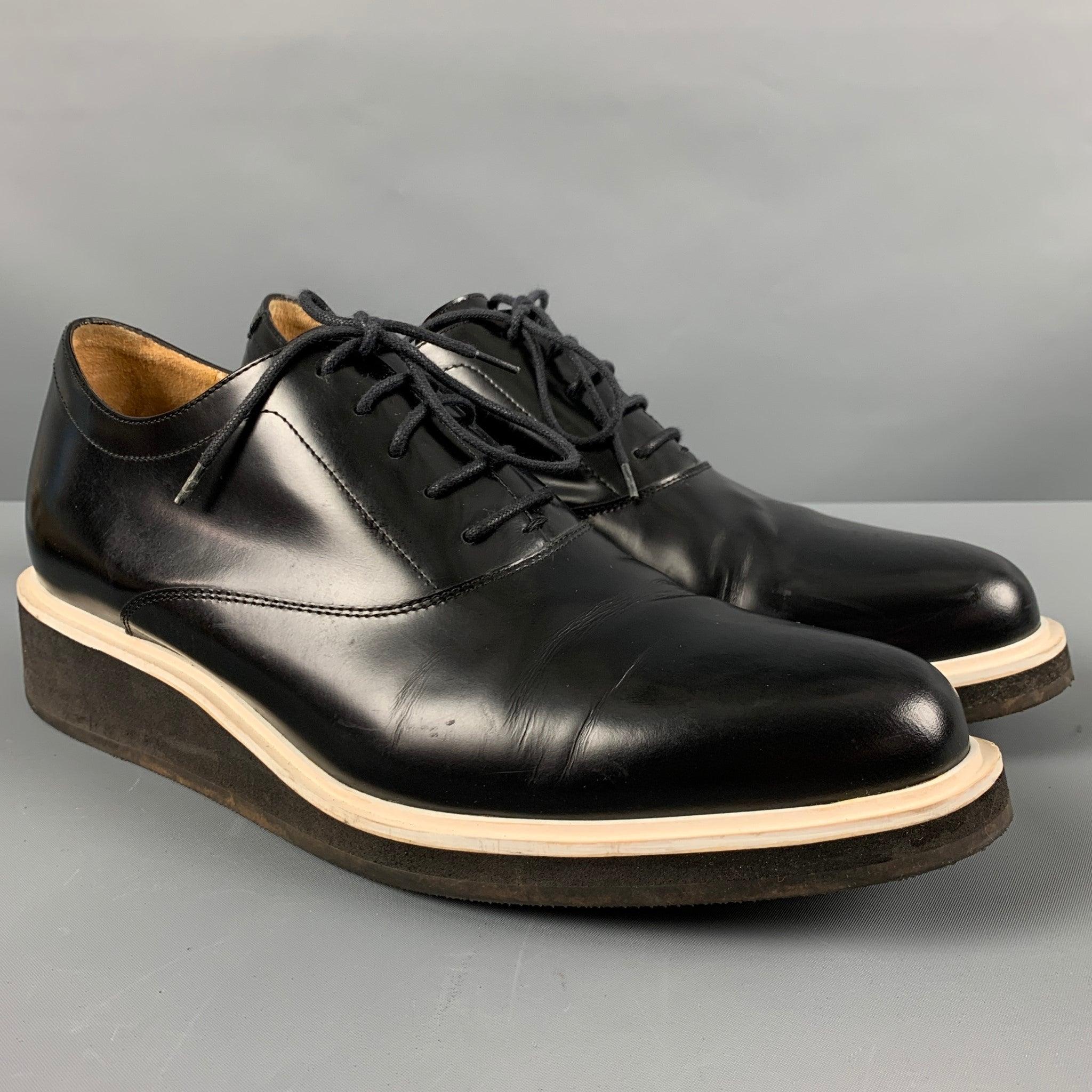 3.1 PHILLIP LIM
lace up shoes in a black leather featuring featuring a platform style and white trim.Very Good Pre-Owned Condition. Minor signs of wear. 

Marked:   SHS2-0425DRLM 43Outsole:12.5 inches  x 4.5 inches  
  
  
 
Reference: