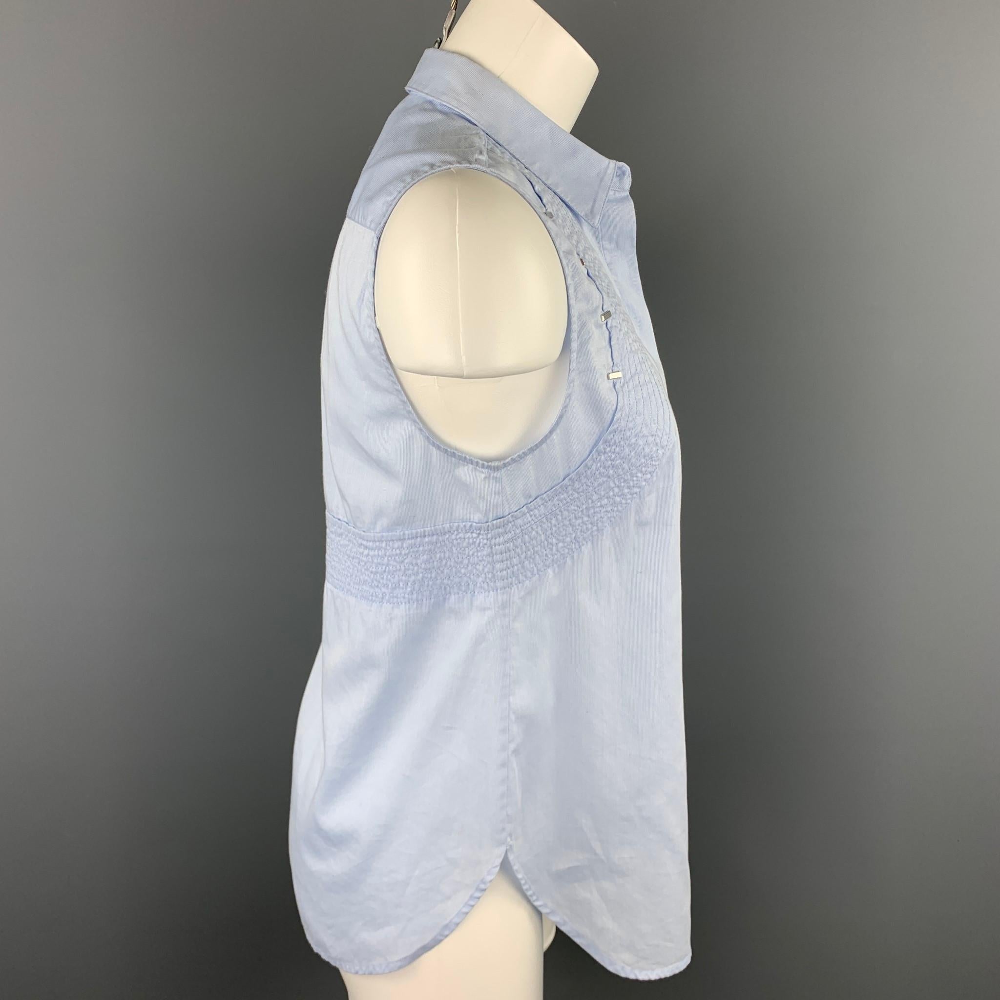3.1 PHILLIP LIM blouse comes in a light blue striped poplin cotton featuring top stitching, silver tone details, spread collar, and a hidden button closure.

Very Good Pre-Owned Condition.
Marked: 2

Measurements:

Shoulder: 13 in. 
Bust: 34 in.