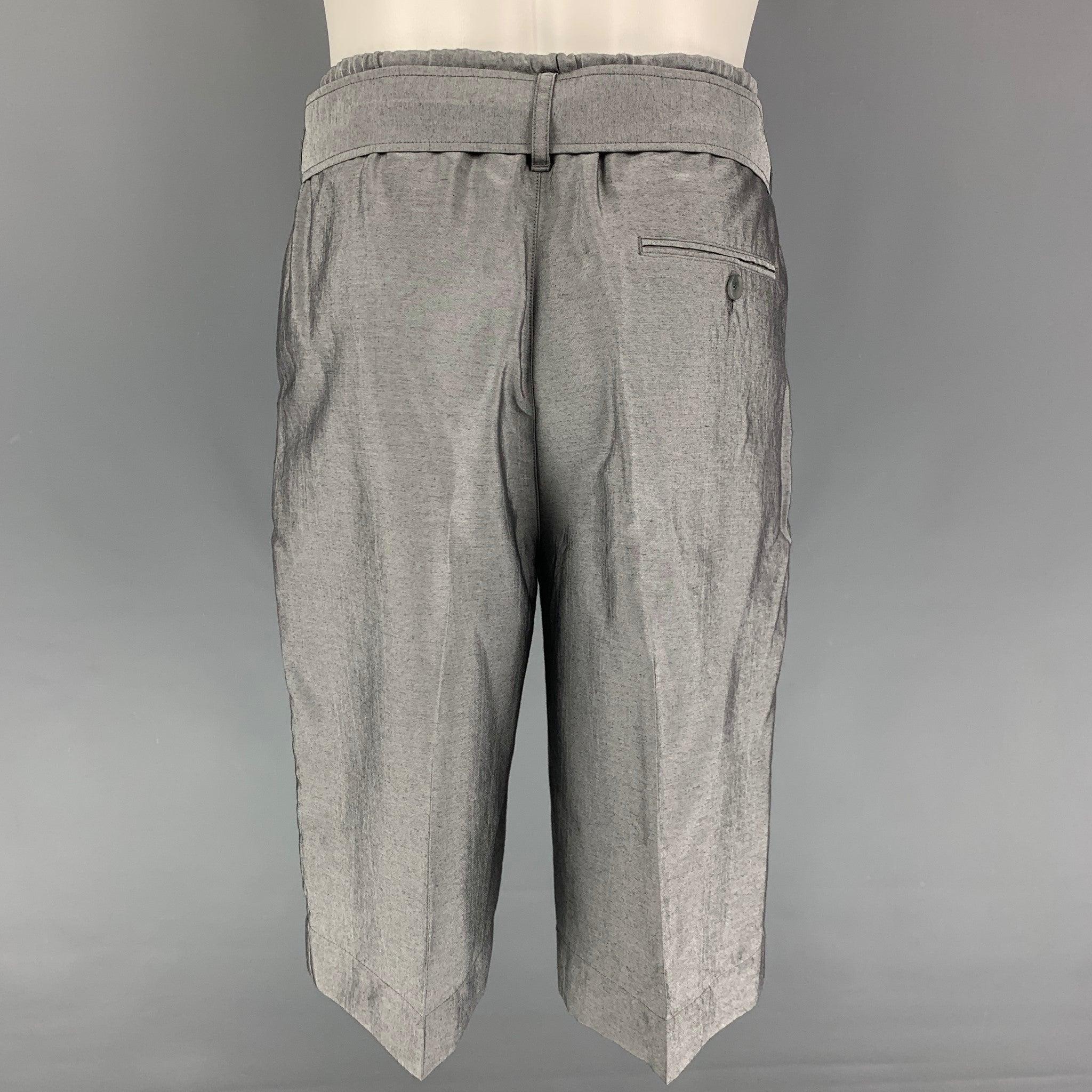 3.1 PHILLIP LIM shorts comes in a silver viscose blend featuring a elastic waistband, belted, and drawstring.
Very Good
Pre-Owned Condition. 

Marked:   31 

Measurements: 
  Waist: 31 inches  Rise: 13 inches Inseam: 12.5 inches 
  
  
 
Reference: