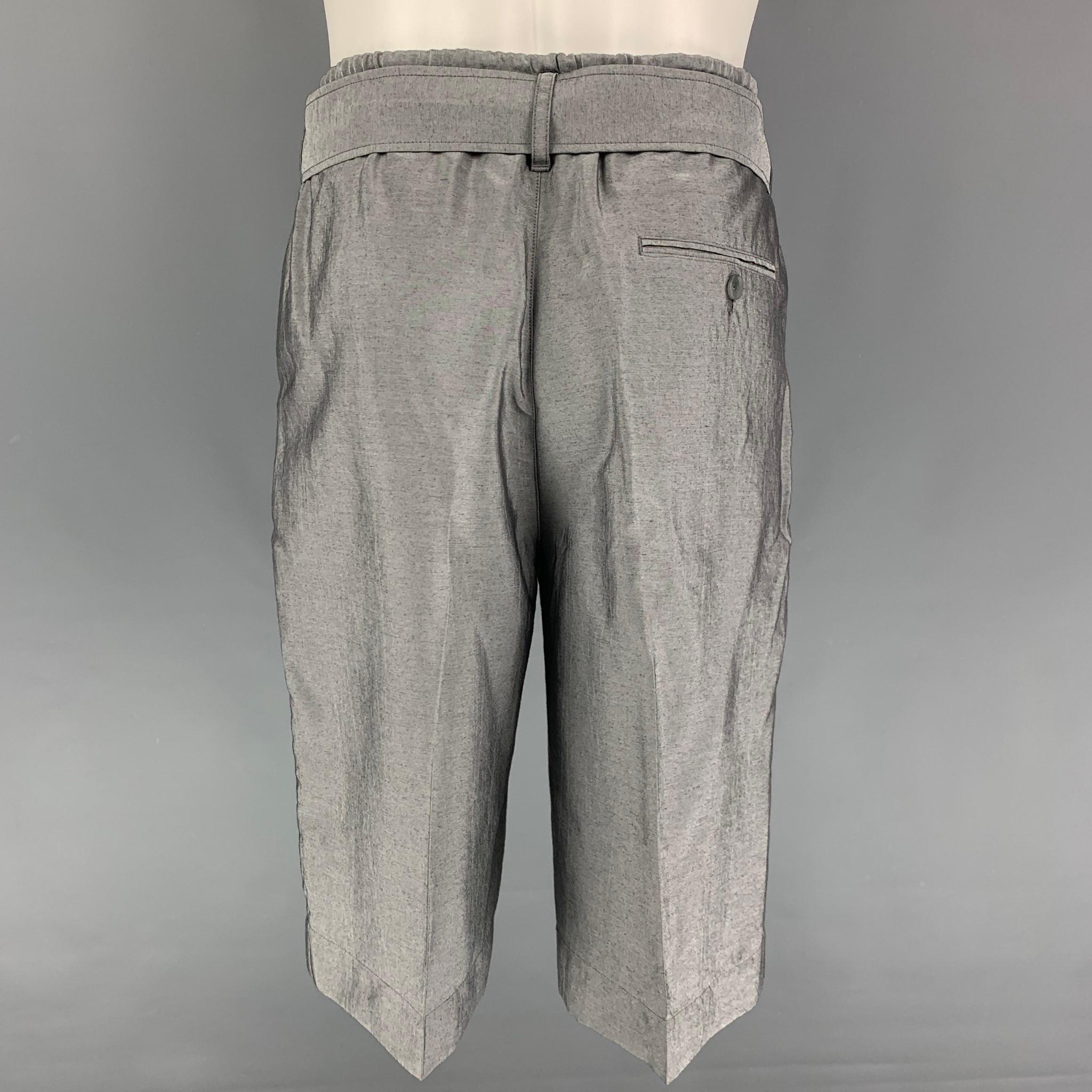 3.1 PHILLIP LIM shorts comes in a silver viscose blend featuring a elastic waistband, belted, and drawstring. 

Very Good Pre-Owned Condition.
Marked: 31

Measurements:

Waist: 31 in.
Rise: 13 in.
Inseam: 12.5 in. 