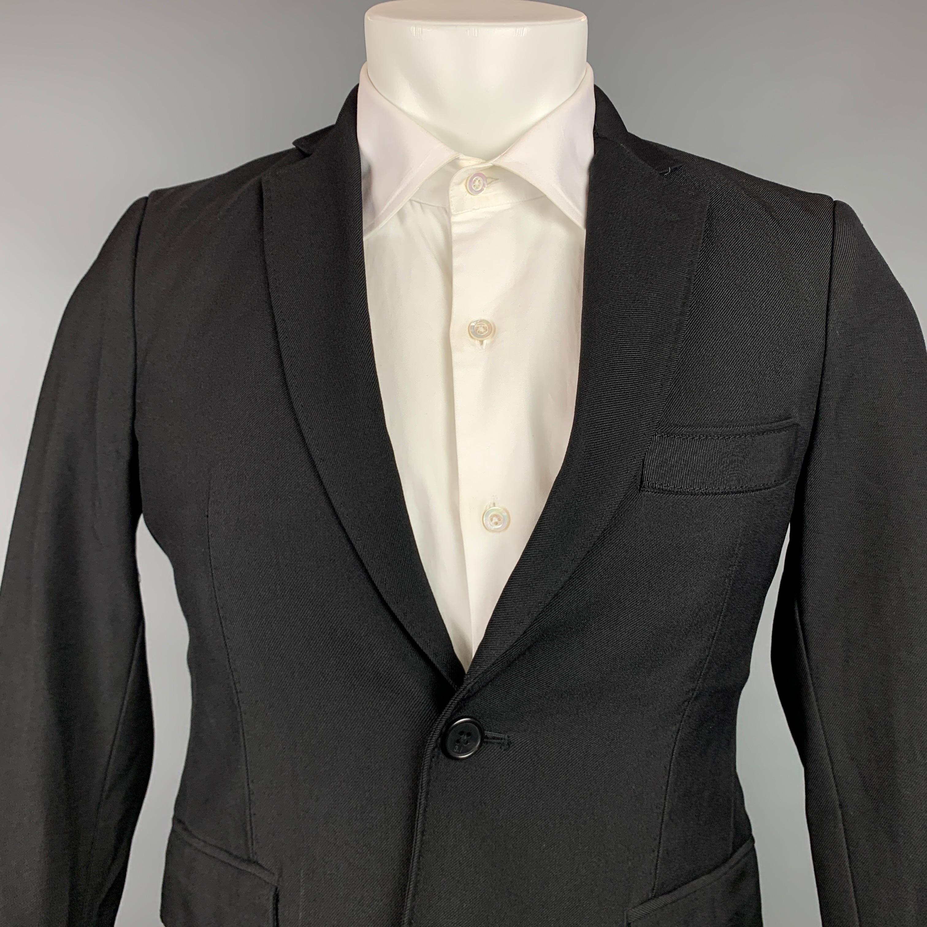 3.1 PHILLIP LIM sport coat comes in a black wool / polyamide with a half liner featuring a notch lapel, patch pockets, and a double button closure.

Very Good Pre-Owned Condition.
Marked: 36

Measurements:

Shoulder: 16.5 in.
Chest: 38 in.
Sleeve: