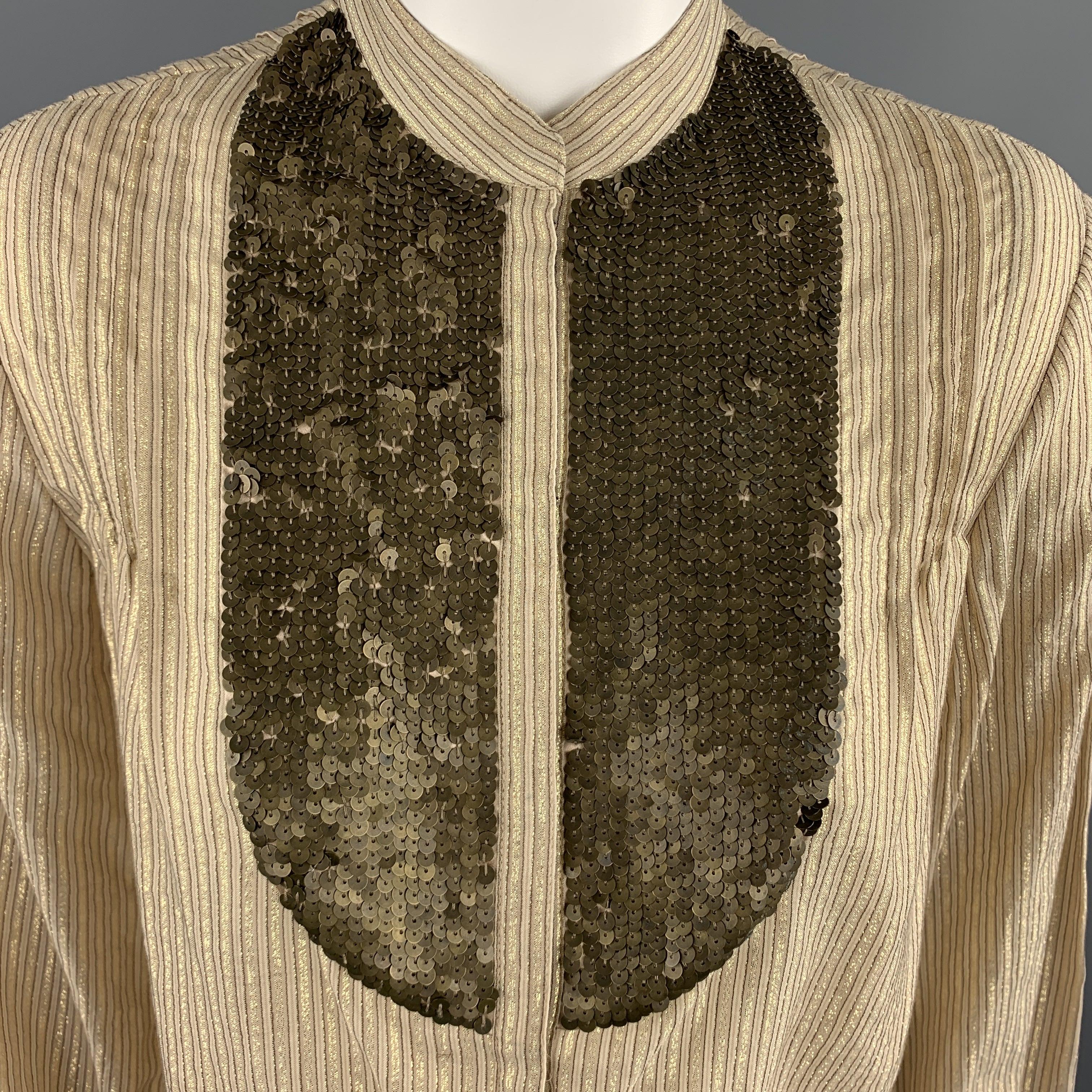 3.1 PHILLIP LIM blouse comes in gold metallic Lurex striped cotton with a band Nehru collar hidden placket snap closure front, and sequin bib panel.
Excellent
Pre-Owned Condition. 

Marked:   US 4 

Measurements: 
 
Shoulder: 14 inches Chest:
38