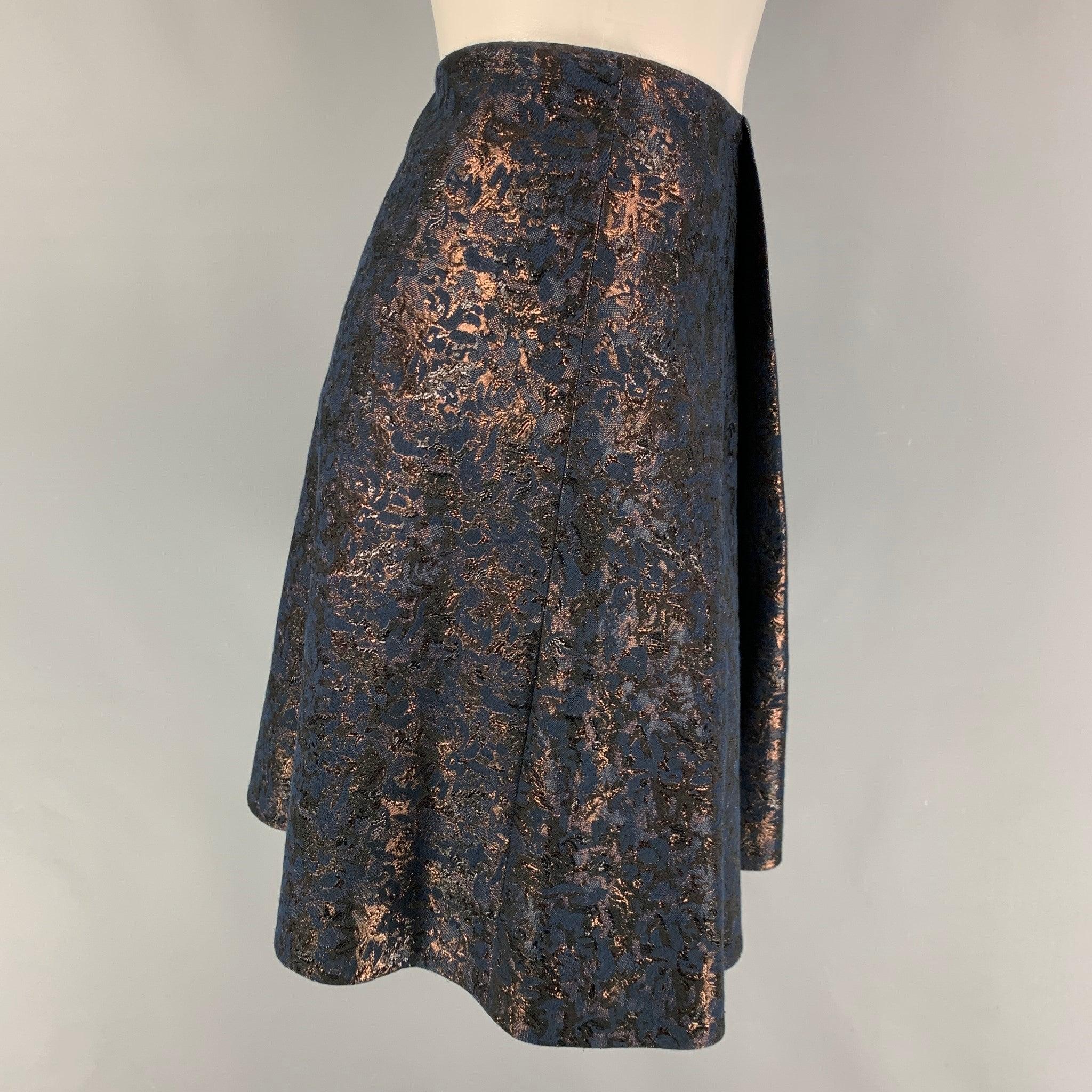 3.1 PHILLIP LIM skirt in a navy jacquard cotton featuring a faux wrap style and a side zipper closure.
Excellent Pre-Owned Condition. 

Marked:   4 

Measurements: 
  Waist: 28 inches Hip: 38 inches  Length: 18 inches 

  
  
 
Sui Generis