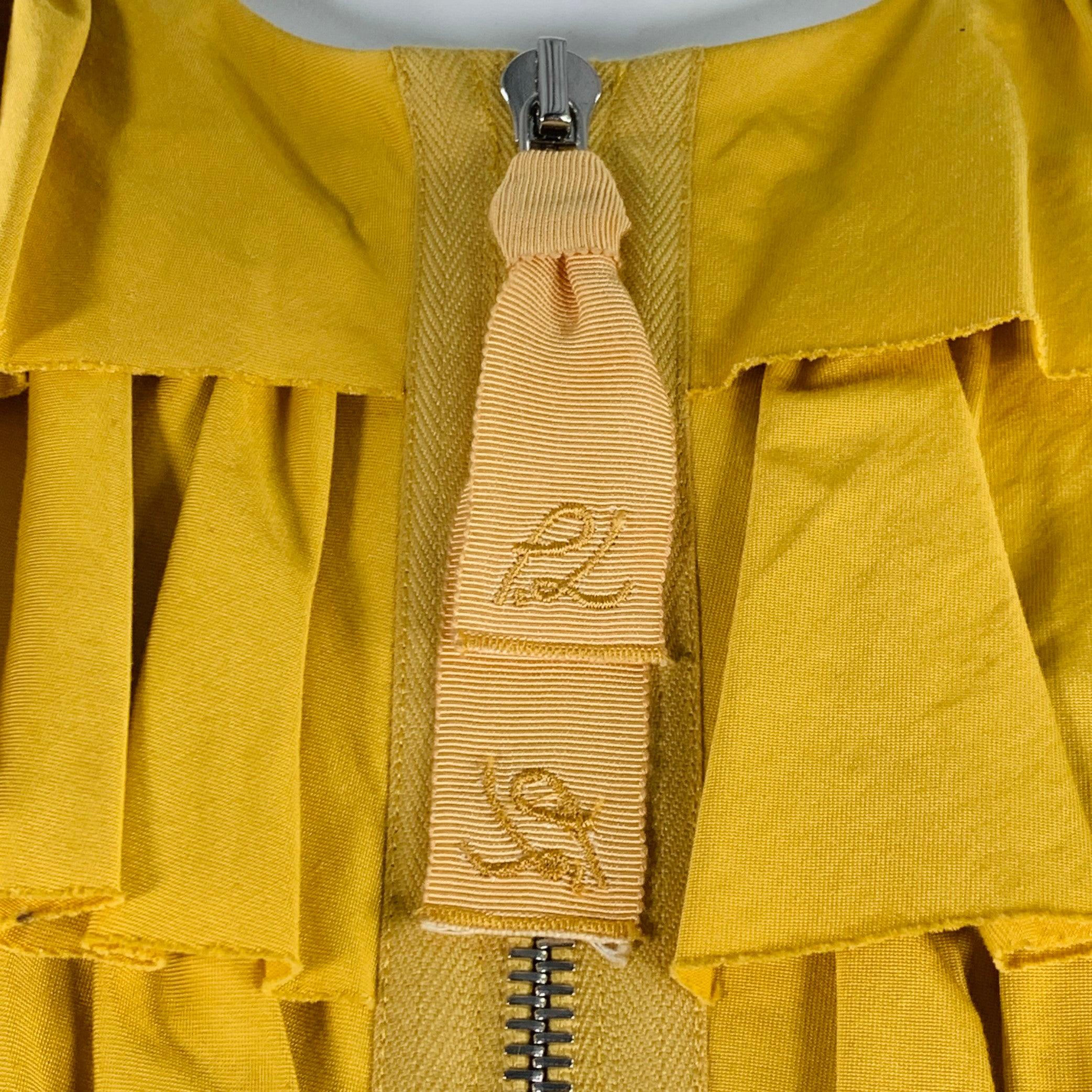 3.1 PHILLIP LIM jacket
in a yellow cotton blend woven fabric featuring a ruffled front, collarless style, and zip up closure.Very Good Pre-Owned Condition. Minor mark inside of garment. 

Marked:   4 

Measurements: 
 
Shoulder: 14.5 inches Bust: 33