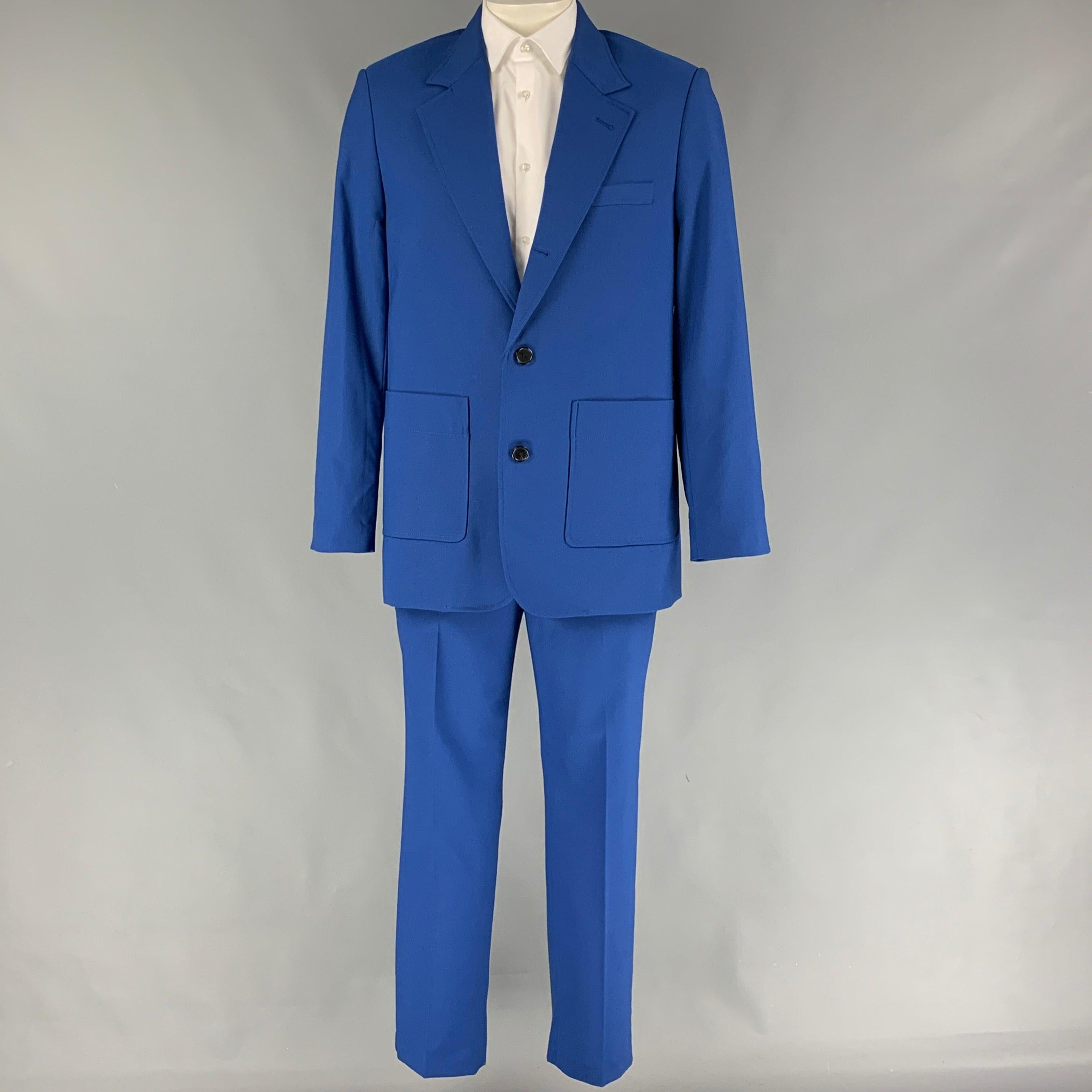 3.1 PHILLIP LIM
suit comes in a royal blue wool blend and includes a single breasted, three button sport coat with a notch lapel and matching flat front trousers. Comes with tags. Very Good Pre-Owned Condition.  

Marked:   40 

Measurements: 
 
