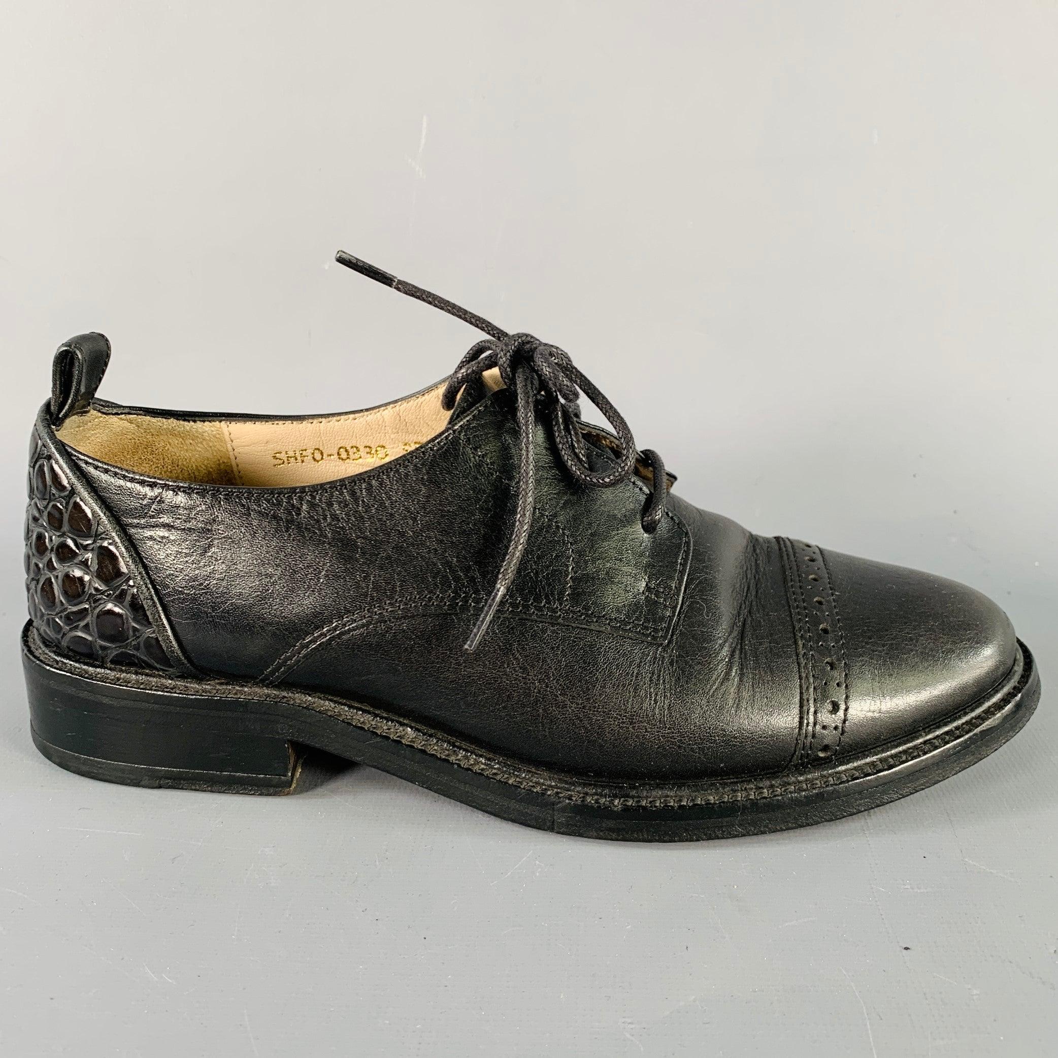 3.1 PHILLIP LIM flats
in a black leather featuring a derby style, cap toe with perforated detail, textured heel accents, and lace-up closure.
 Good Pre-Owned Condition. Moderate signs of wear on soles. 

Marked:   SHF0-0330 SPZ 36Outsole: 9 inches 