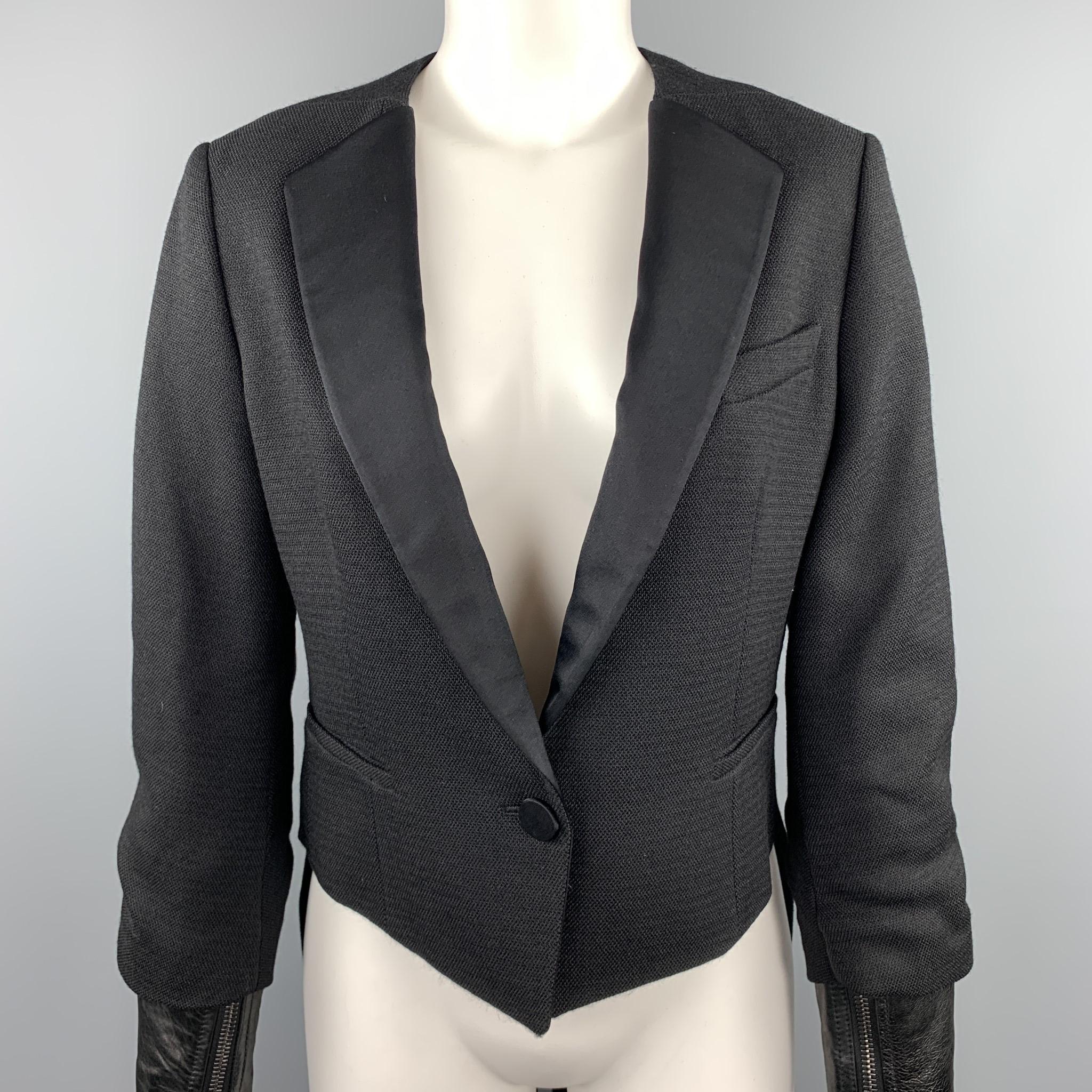 3.1 PHILLIP LIM jacket comes in woven wool with a collarless satin tuxedo notch lapel, single button front, double coat tails back, and detachable leather biker jacket cuffs.  Retailed $830

Excellent Pre-Owned Condition.
Marked: US