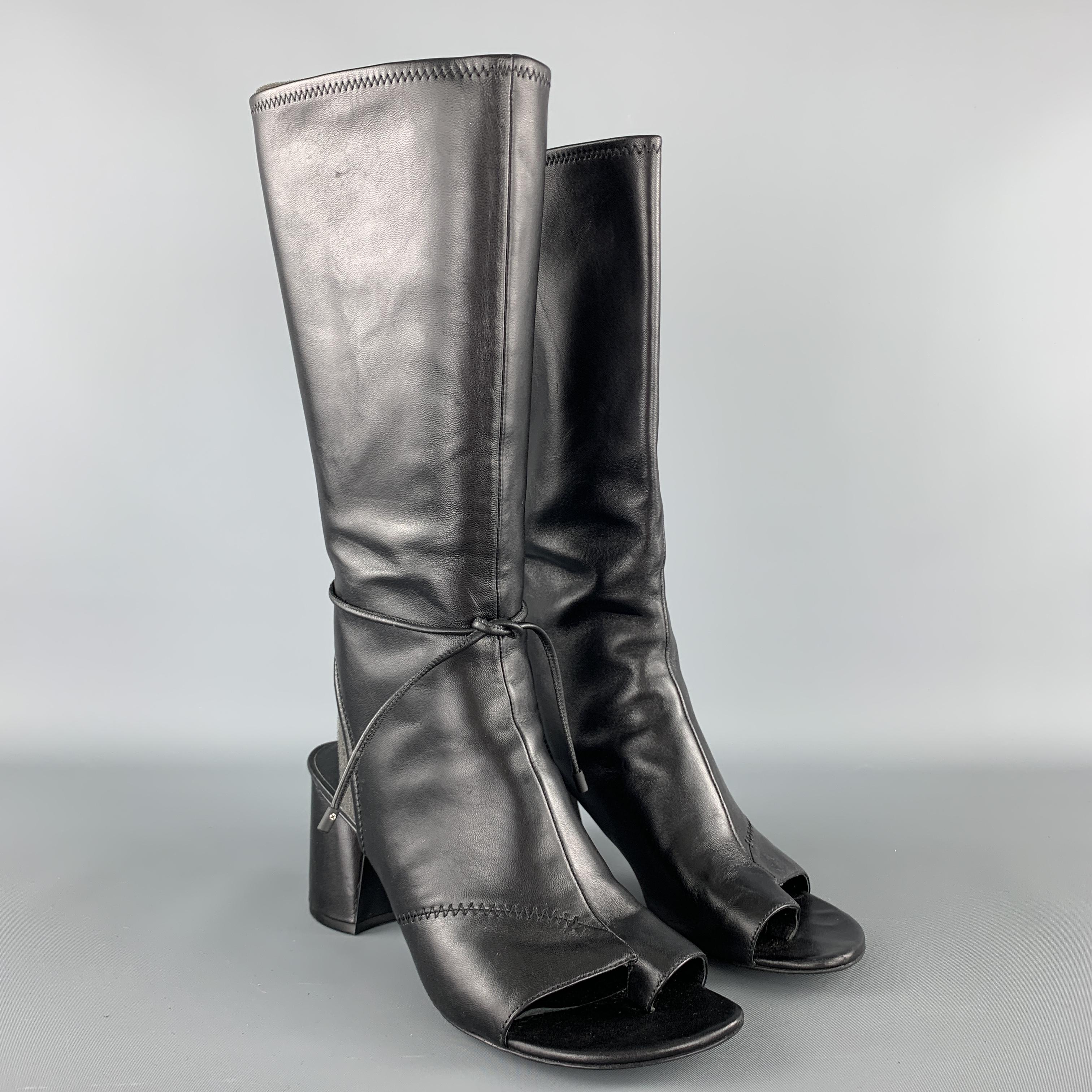 3.1 PHILLIP LIM sandal boots come in smooth black leather with an open toe and heel , tall shaft with tie strap, and chunky heel. With box. 

Excellent Pre-Owned Condition.
Marked: IT 39

Heel: 3 in.
Length: 12.5 in.