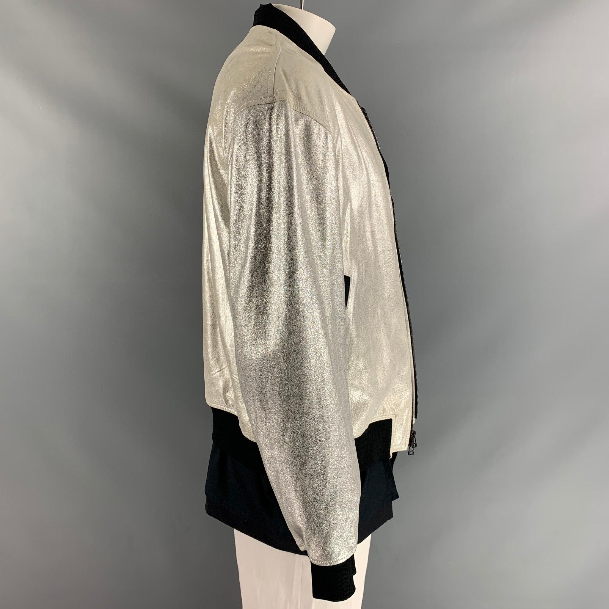3.1 PHILLIP LIM bomber jacket, fully lined comes in silver lamb leather, black wool and cotton fabrics featuring simulated layers and two welt pockets at front.Excellent Pre-Owned Condition.  

Marked:   L 

Measurements: 
 
Shoulder: 23 inChest: 52
