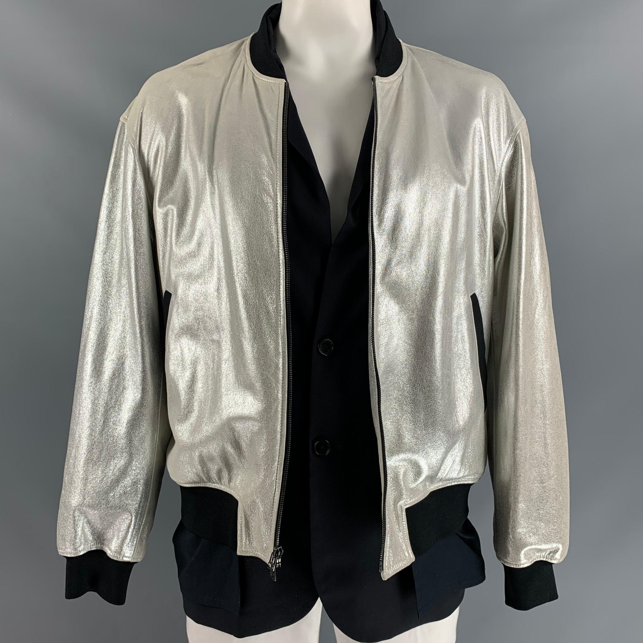 3.1 PHILLIP LIM bomber jacket, fully lined comes in silver lamb leather, black wool and cotton fabrics featuring simulated layers and two welt pockets at front.

Excellent Pre-Owned Condition.
Marked: L

Measurements:

Shoulder: 23 in
Chest: 52