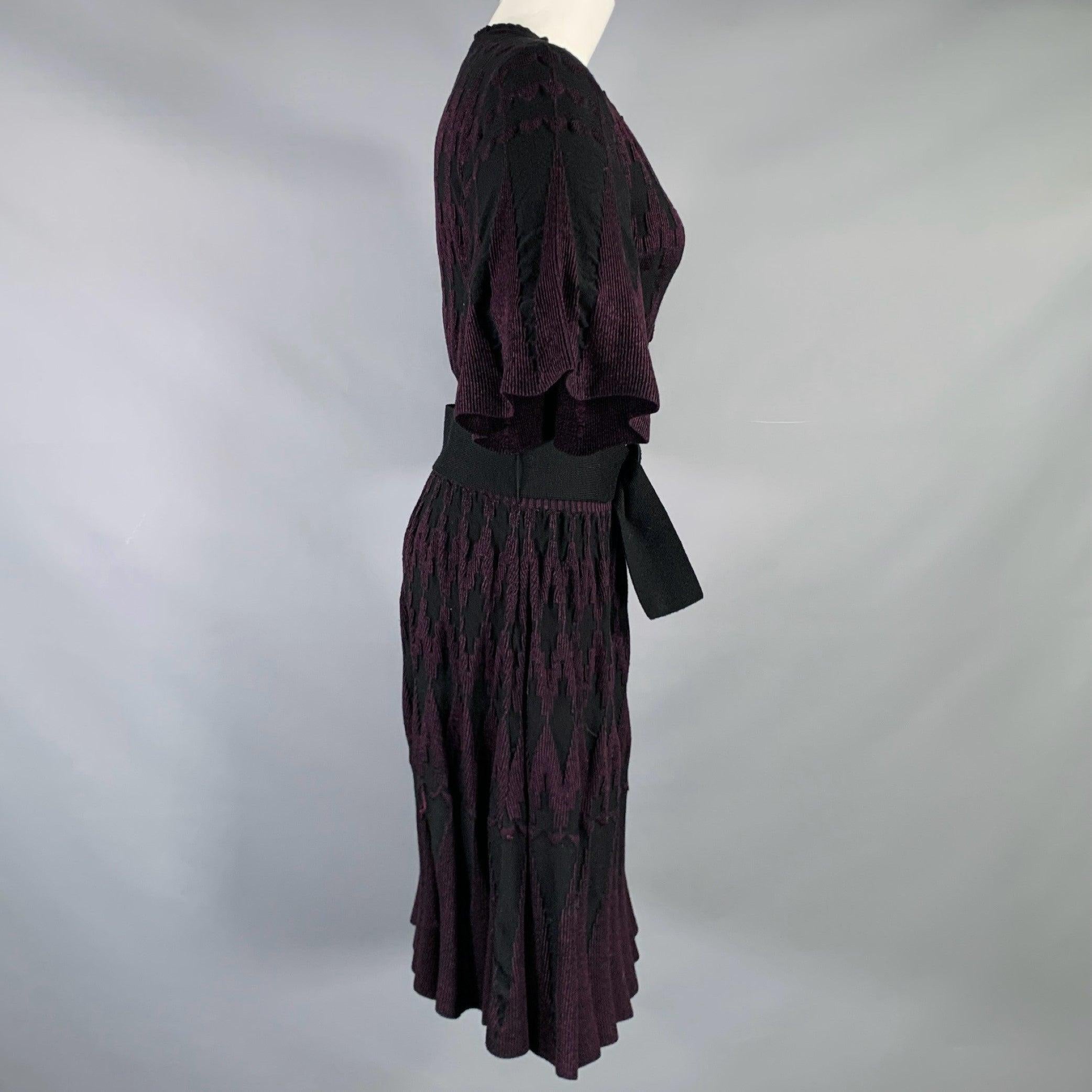 3.1 PHILLIP LIM dress
in a purple and black wool silk blend knit featuring a geometric pattern, belted style, knee length, butterfly sleeves, and button closure. Very Good Pre-Owned Condition. Minor signs of wear. 

Marked:   M 

Measurements: 
