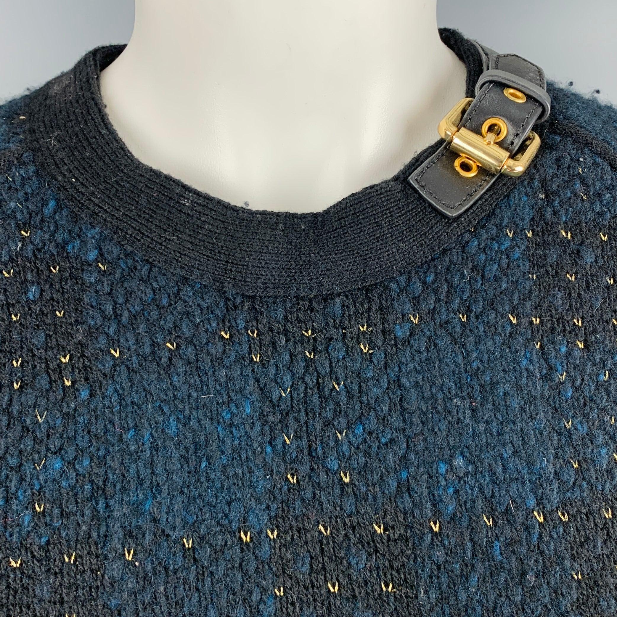 3.1 PHILLIP LIM sweater
in a
black wool blend knit featuring gold tone details throughout, matched in the gold tone buckle leather collar detail.Very Good Pre-Owned Condition. Moderate pilling, as is. 

Marked:   S 

Measurements: 
 
Shoulder: 17.5