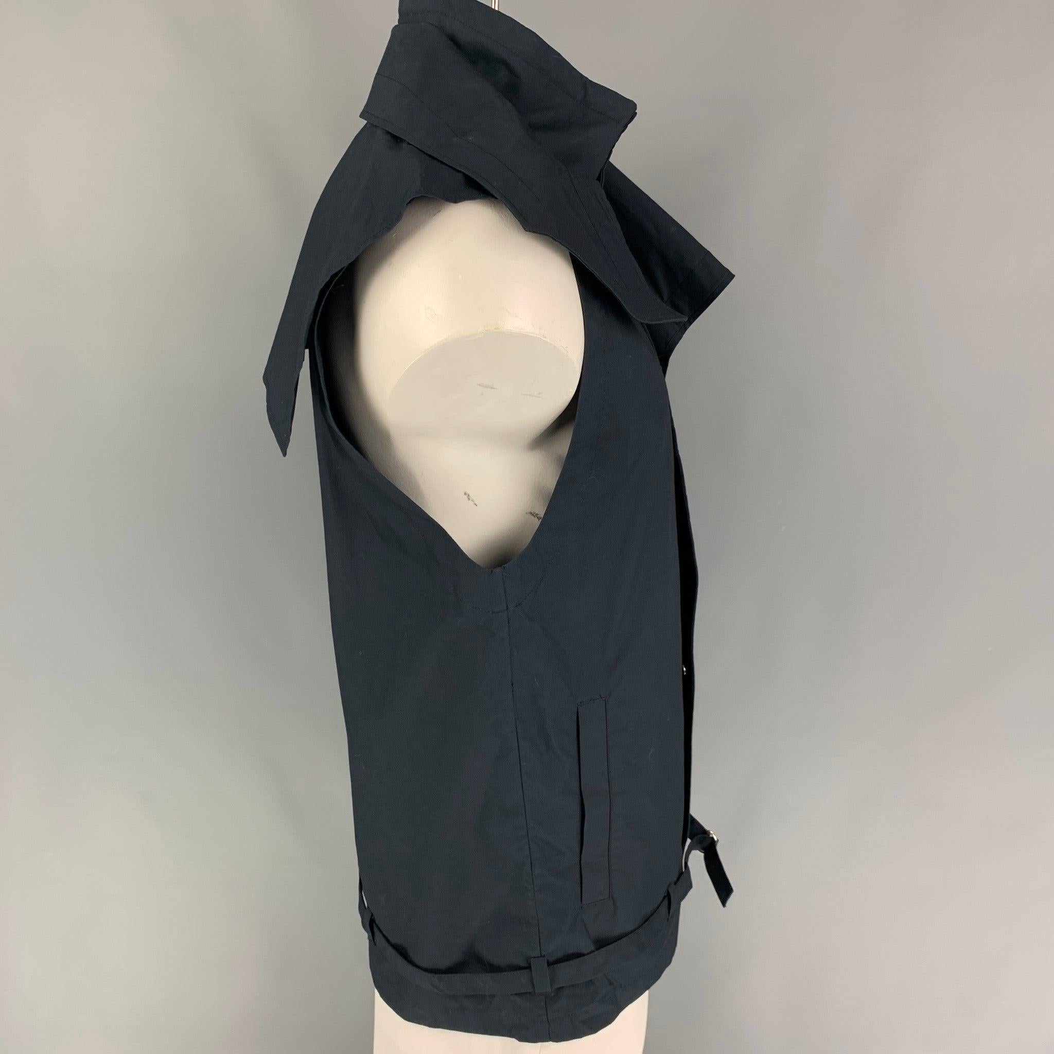 3.1 PHILLIP LIM vest comes in a navy cotton featuring a detachable collar, front pockets, belted detail, and a hidden snap button closure.
Very Good
Pre-Owned Condition. 

Marked:   S 

Measurements: 
 
Shoulder: 18 inches  Chest: 42 inches  Length: