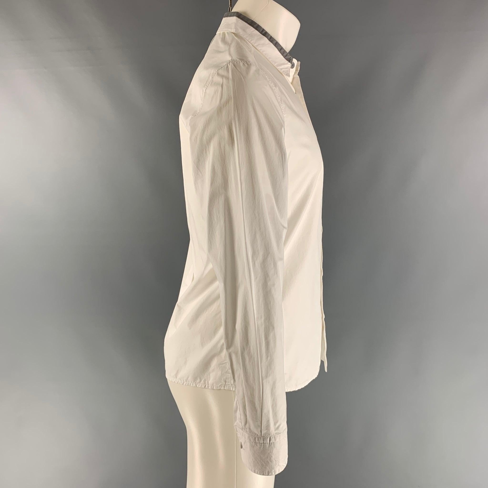 3.1 PHILLIP LIM long sleeve shirt comes in a white cotton featuring a button up closure, one button round cuff, and a straight collar. Excellent Pre-Owned Condition. 
 

 Marked:  S 
 

 Measurements: 
  
 Shoulder: 18 inches Chest: 42 inches