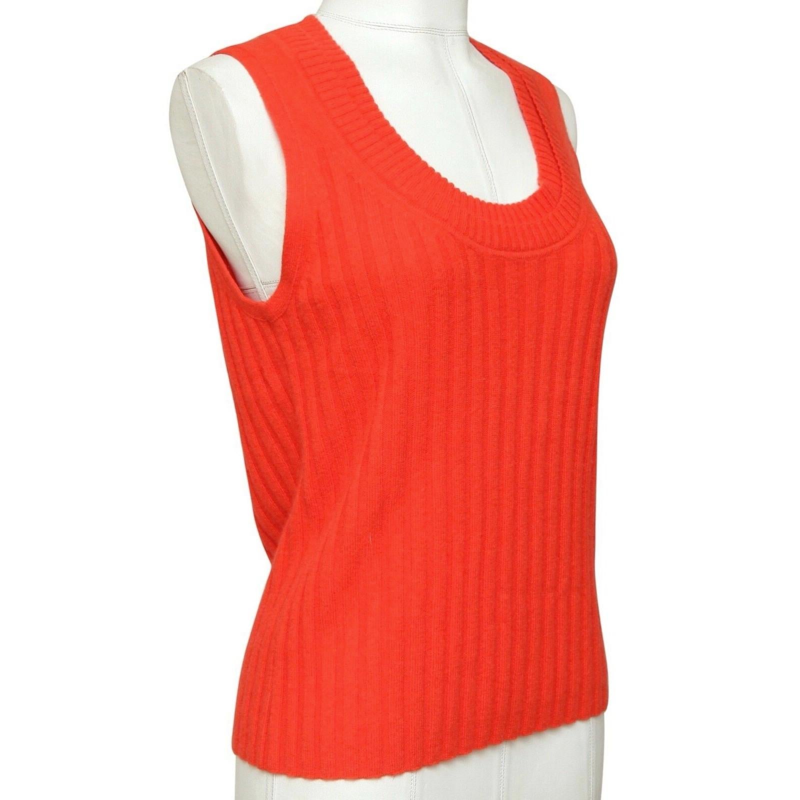 GUARANTEED AUTHENTIC ORANGE SLEEVELESS RIBBED SWEATER

Details:
- Lightweight orange ribbed sleeveless knit sweater.
- Crew neck.
- Easy and year round great piece for your 3.1 Phillip Lim collection.

Size: L

Fabric: 98% Cashmere, 1% Polyamide, 1%
