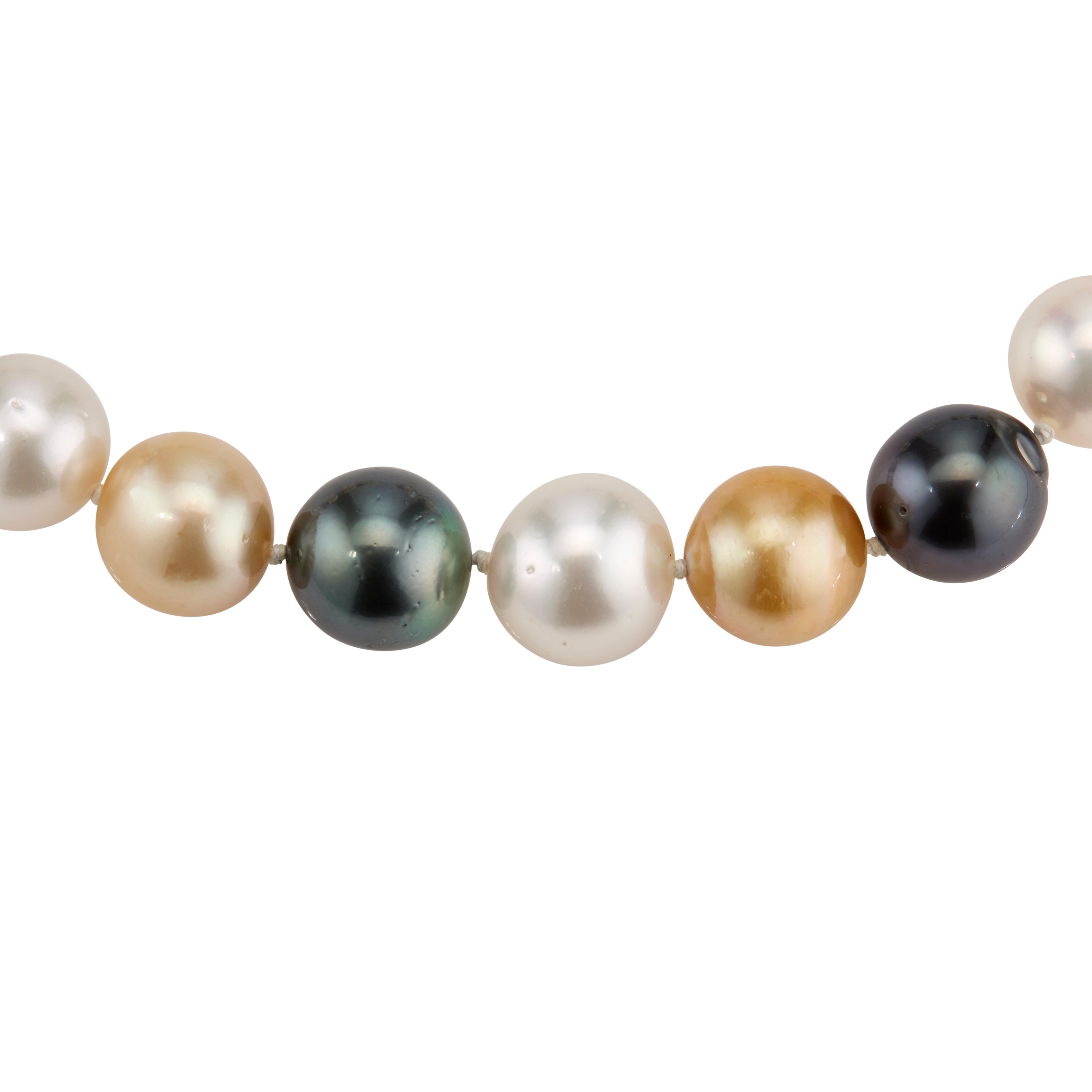 Multicolor South Sea cultured pearl necklace with white black and golden yellow 12mm to 15mm pearls on a 14k yellow gold catch. Good lustre, moderate natural blemishes. 18 inches in length. 

11 South Sea cultured white pearls, 12mm-15mm 
10 South