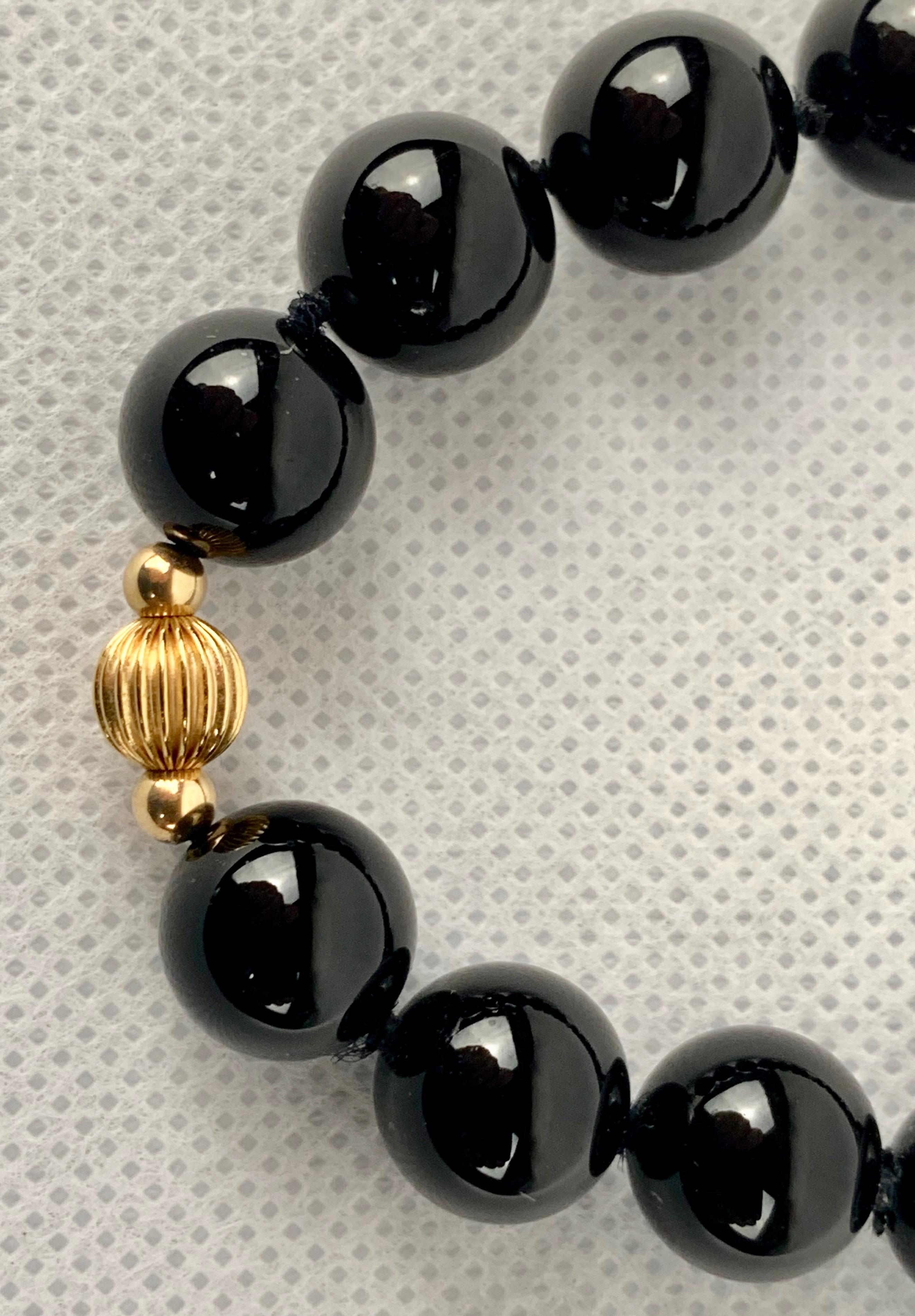 Round Cut Strand of Black Onyx and 14 Karat Gold Spacers