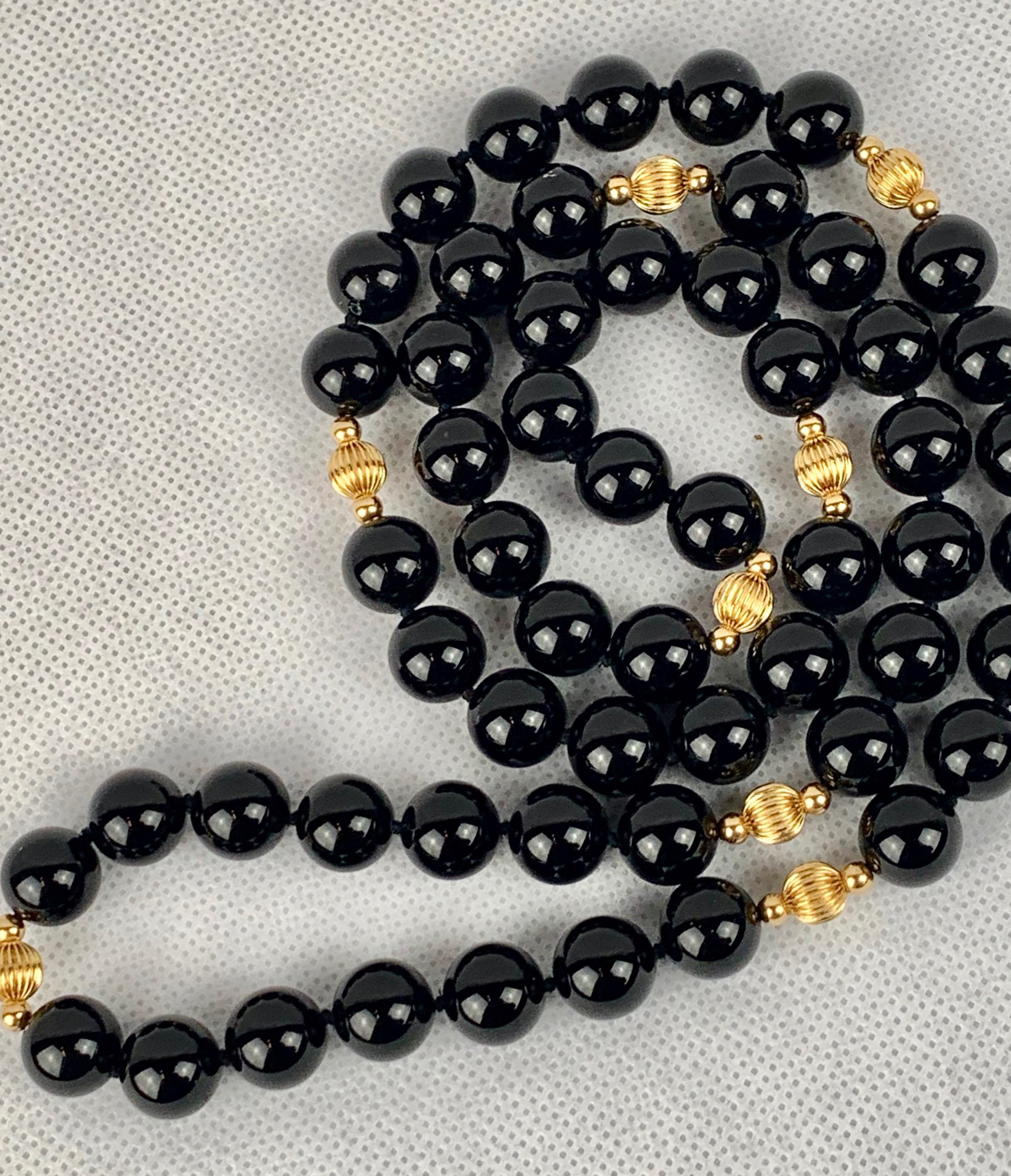 Strand of Black Onyx and 14 Karat Gold Spacers 1